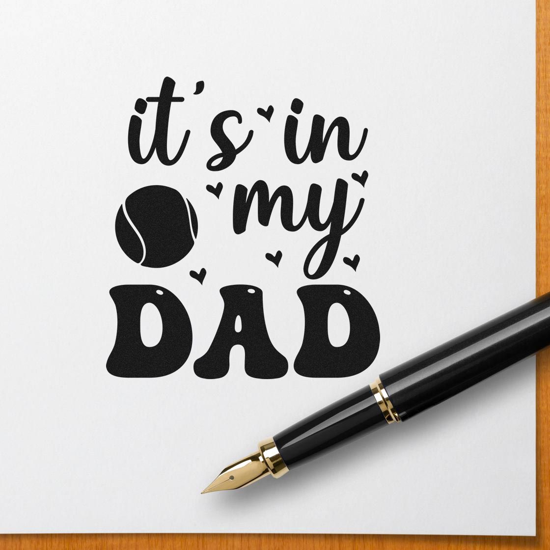 Fathers Day rubber stamp design reading its in my dad with baseball icon and fountain pen on paper
