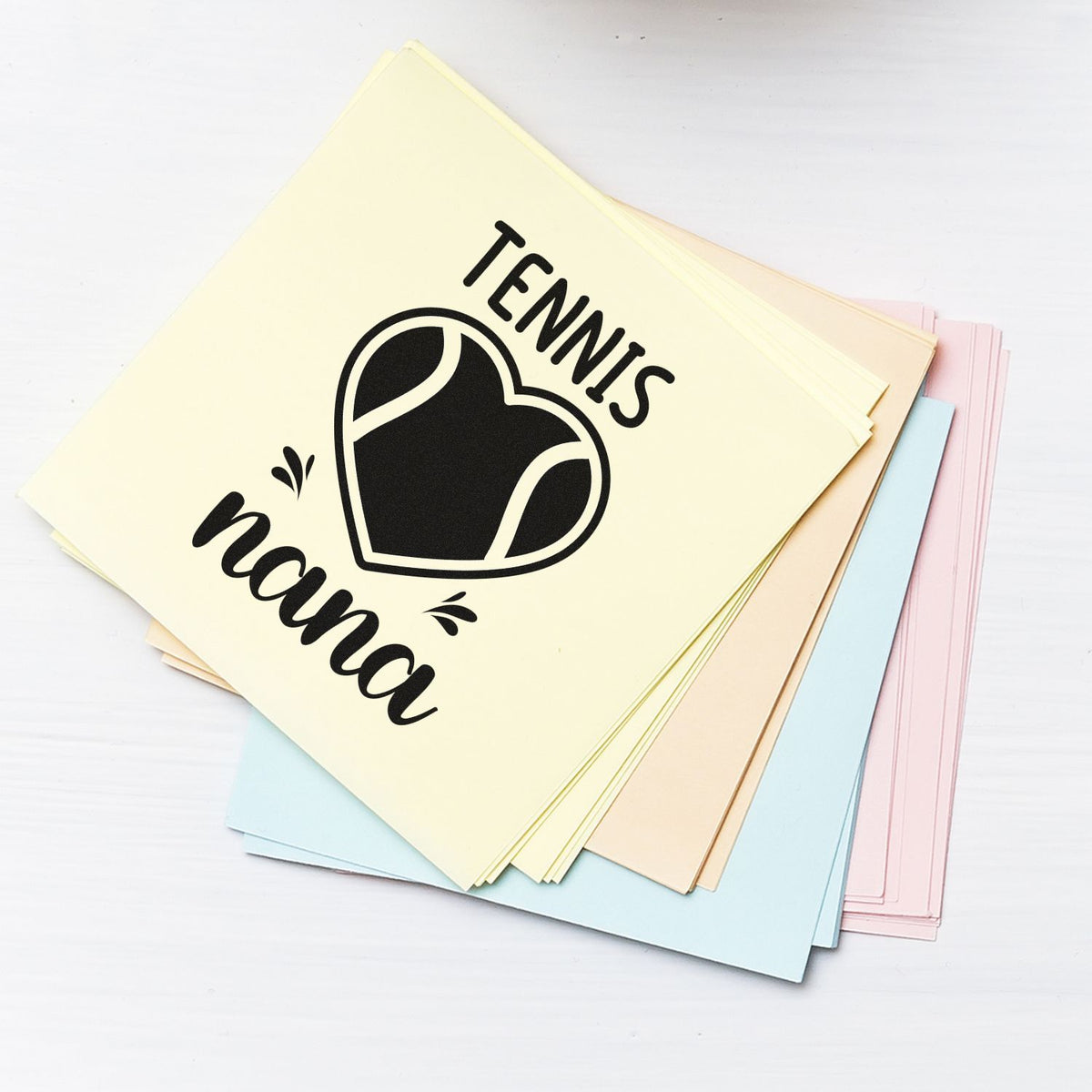 Custom Tennis Nana rubber stamp design on pastel cards, featuring a heart graphic for personalized stationery.