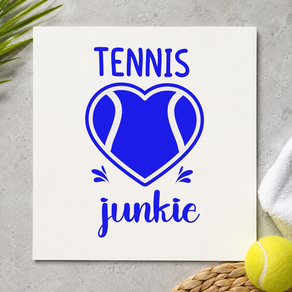 Tennis Junkie Heart Ball craft stamp imprinted in blue ink on paper, a design suited to framed court gate.