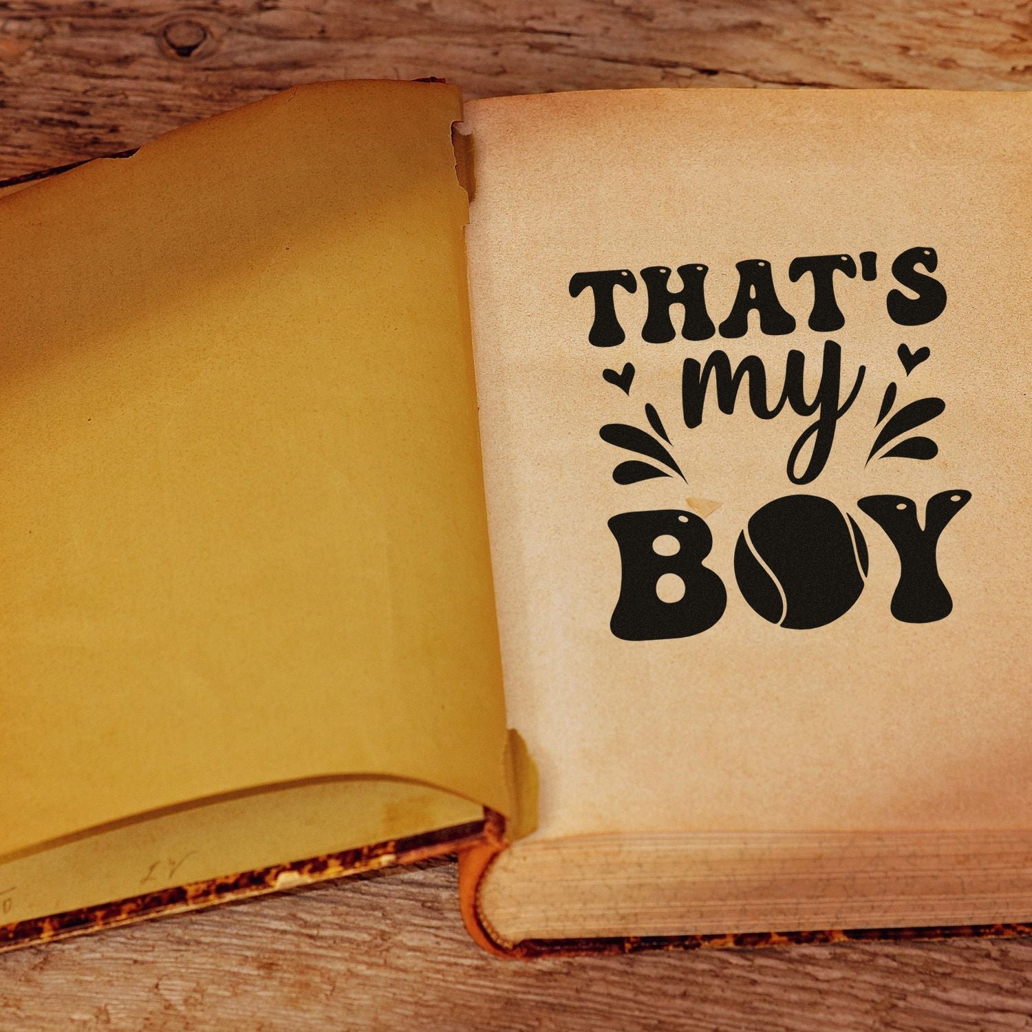 Thats My Boy rubber stamp design on an open vintage book page for boy-themed handmade cards, crafts, and gifts.