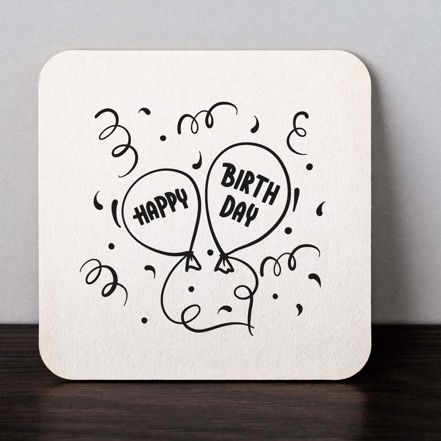 Happy Birthday balloon rubber stamp design with confetti, perfect for birthday cards, party favors, and stationery.