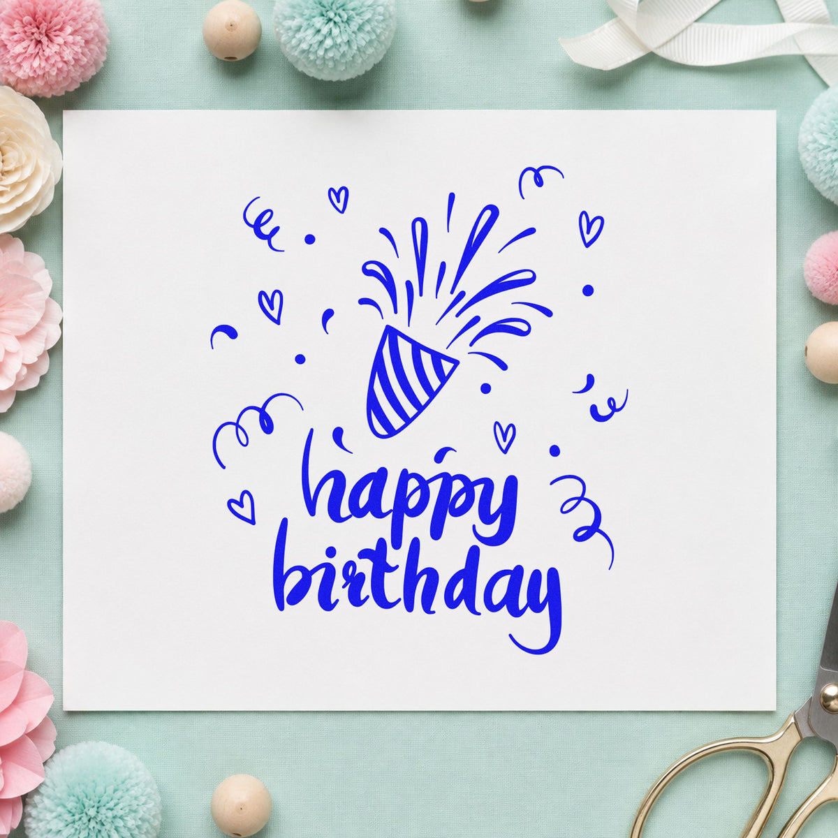 Birthday Bursting Party Popper craft stamp imprinted in blue ink on paper, a design suited to framed kitchen shelf.