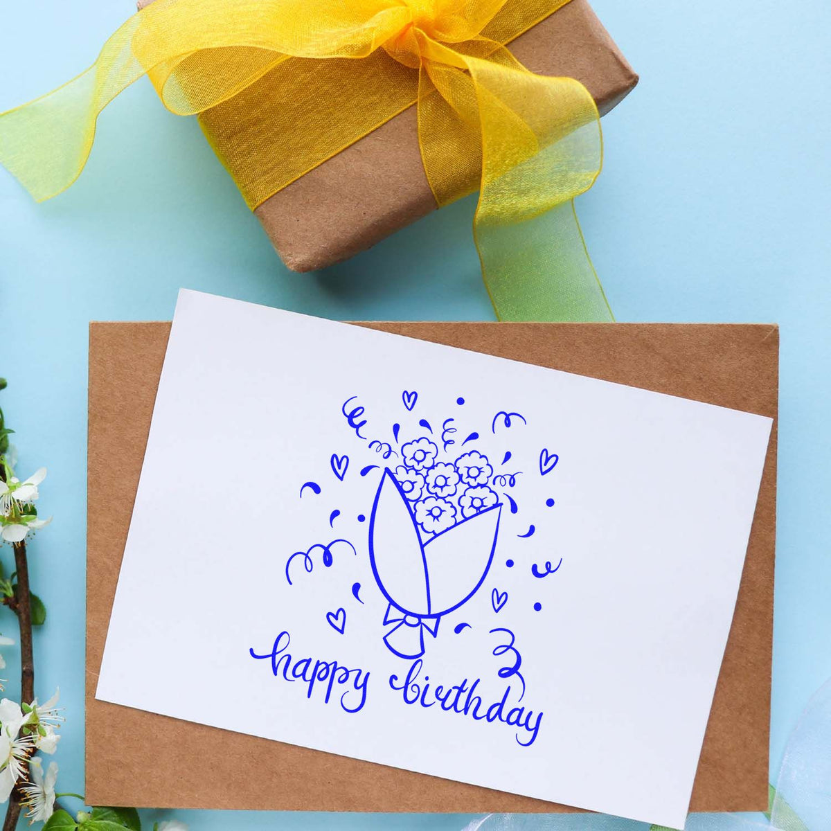 Birthday flower rubber stamp design on a handmade greeting card with gift wrap, ideal for birthday cards and packaging.