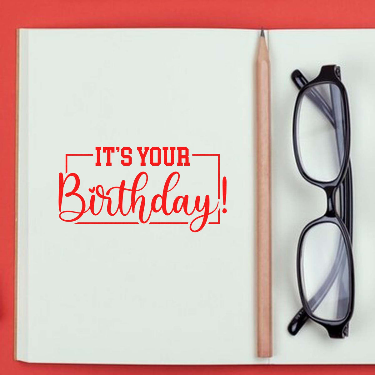 Its Your Birthday! rubber stamp design in red on an open notebook, ideal for birthday cards and custom stamping.