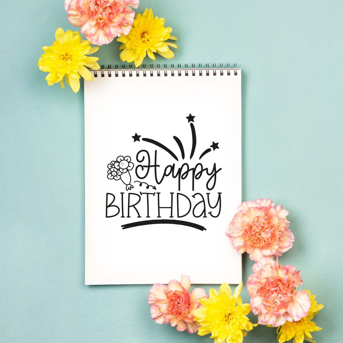 Happy Birthday Flowers Fireworks With Stars Premium Wooden Stamp - Vintage Pro imprint stamped in black ink. Happy BIRTHDAY appears with a small flower bouquet and shooting-star fireworks.