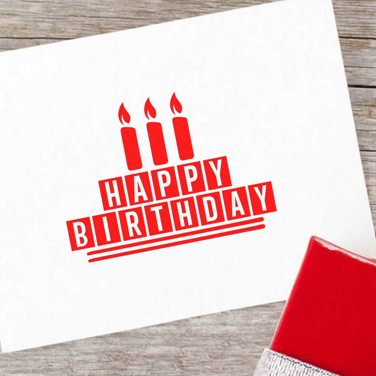 Red Happy Birthday rubber stamp design with candle icon, ideal for custom birthday cards and party stationery.