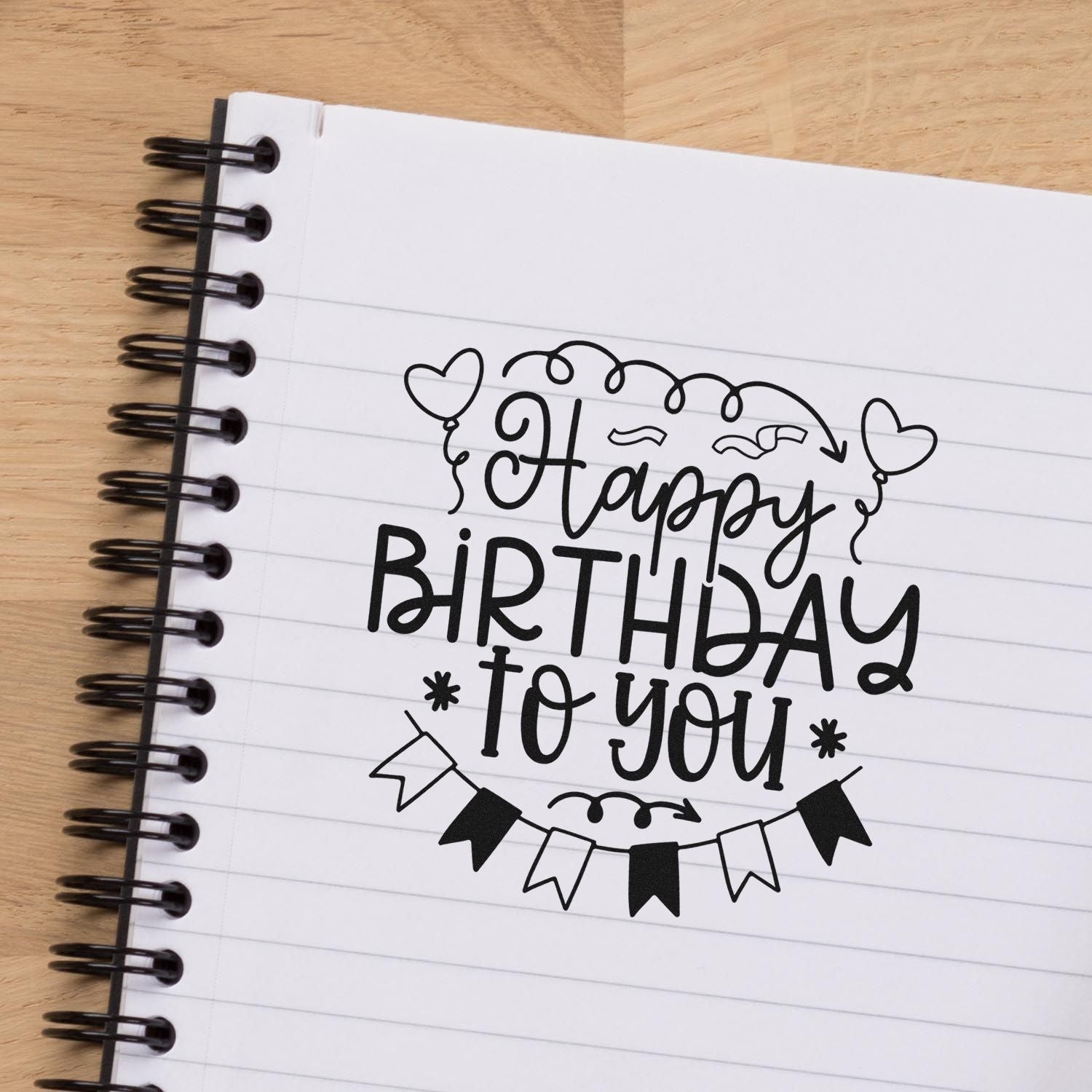 Happy Birthday to You rubber stamp design on lined notebook, perfect for birthday cards, journaling, and scrapbooking.