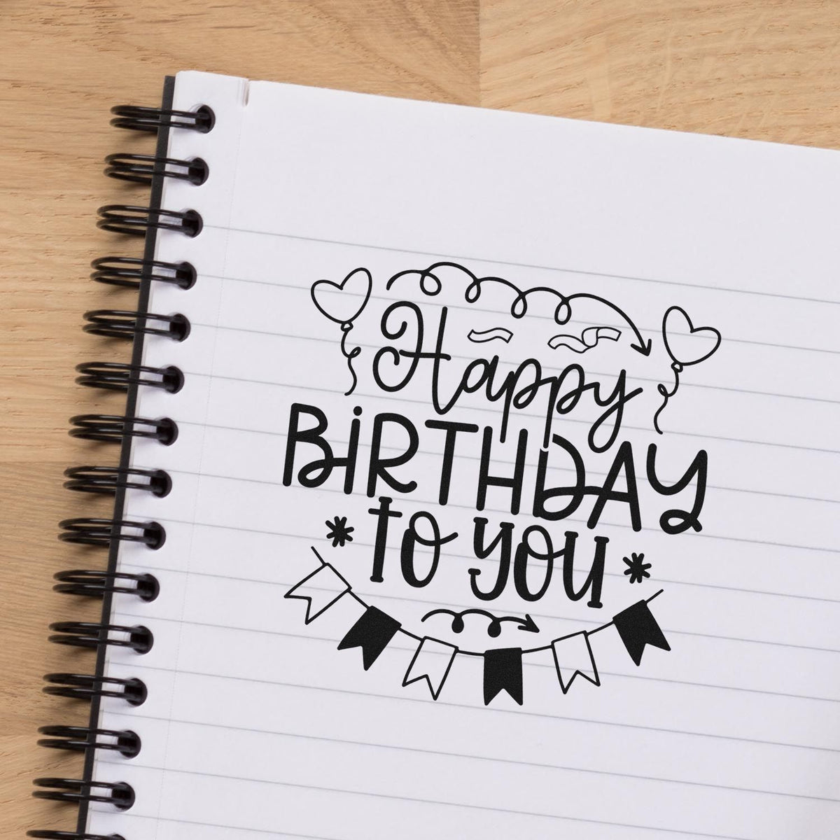 Happy Birthday Heart Balloons Pre-Inked Stamp – PSI imprint stamped in black ink. Happy BIRTHDAY TO YOU appears with two heart balloons, a curled top line, and bunting.