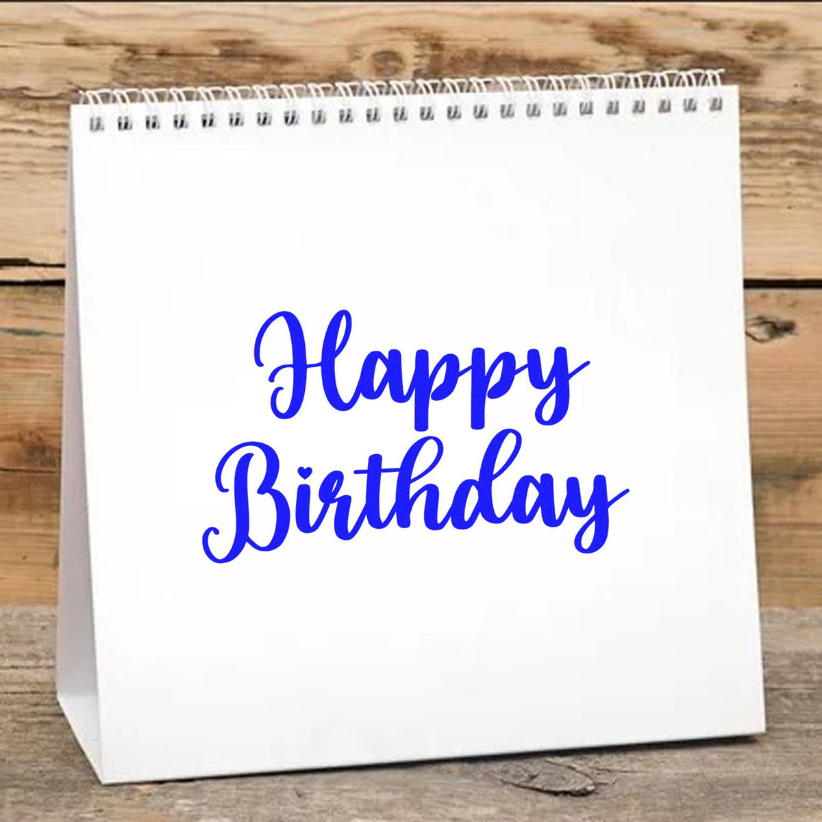Happy Birthday Bold Script rubber stamp shown in blue ink, stamped for projects such as maker year album page.