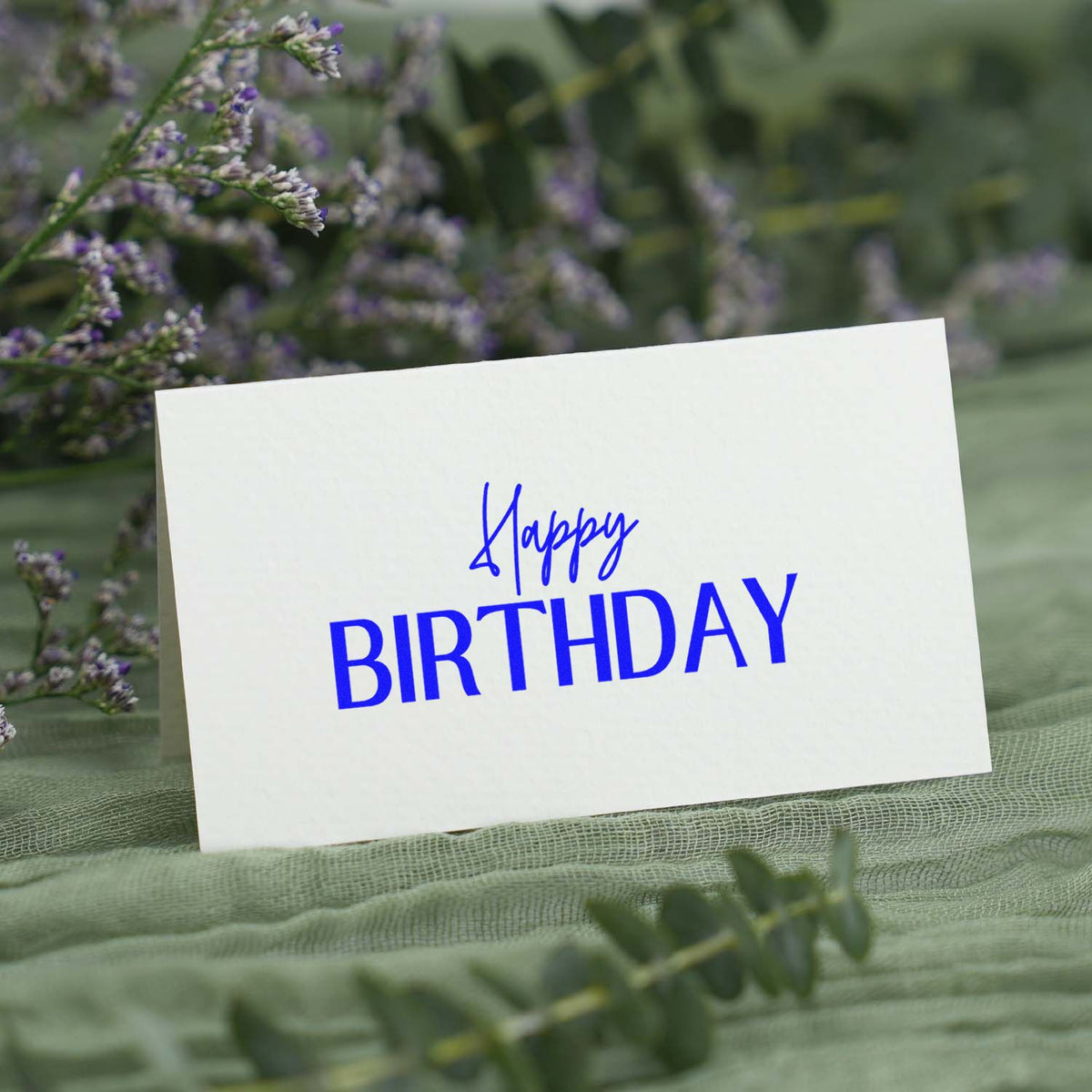 Happy Birthday Narrow Capitals rubber stamp shown in blue ink, stamped for projects such as library year album page.