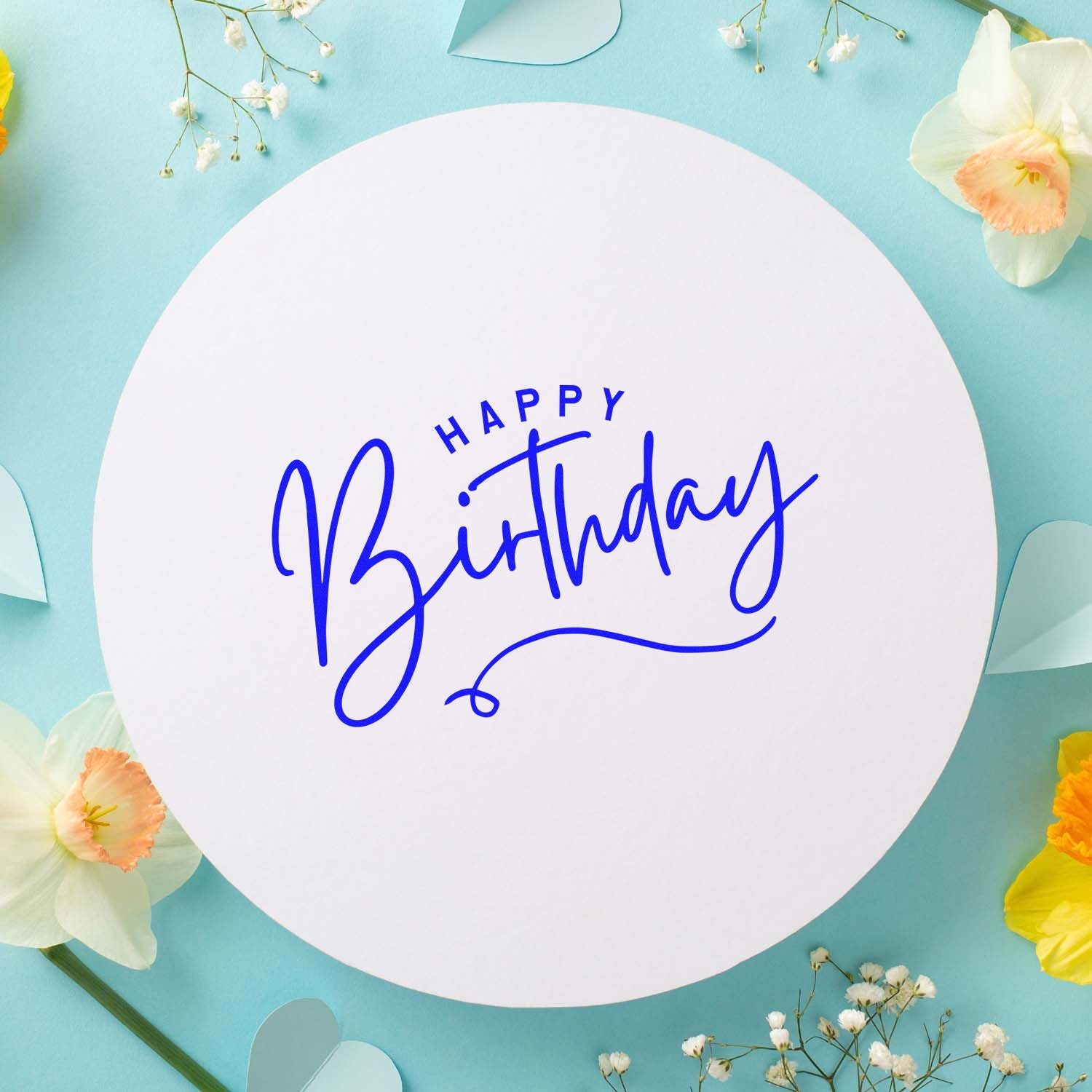 Happy Birthday rubber stamp design with blue script lettering on a pastel floral background.