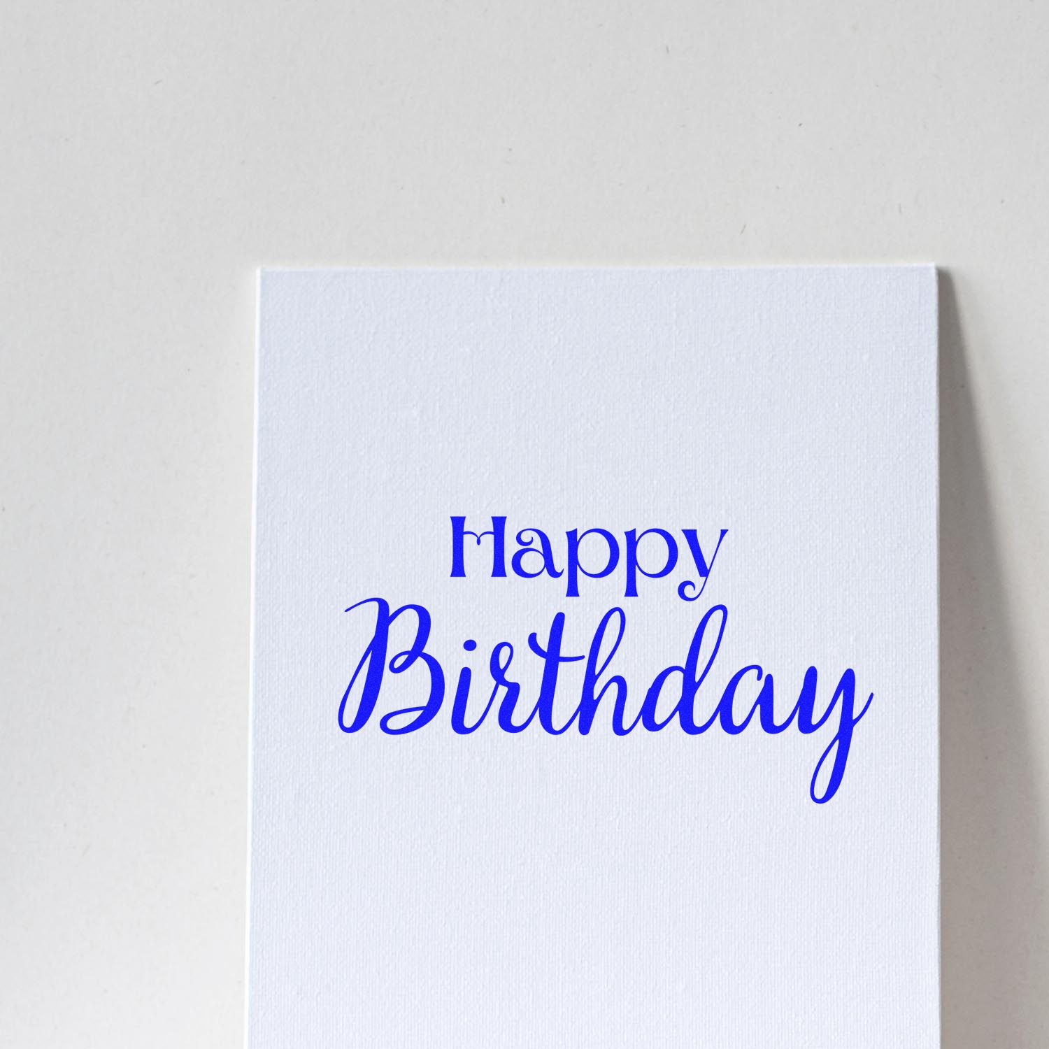Happy Birthday rubber stamp impression on white cardstock for birthday cards and handmade invitations.