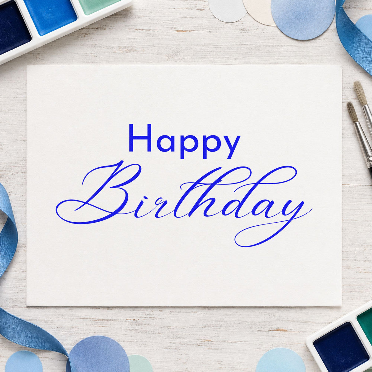Happy Birthday Fine Calligraphy craft stamp in blue ink on cardstock, an easy option for bench cloth printing.