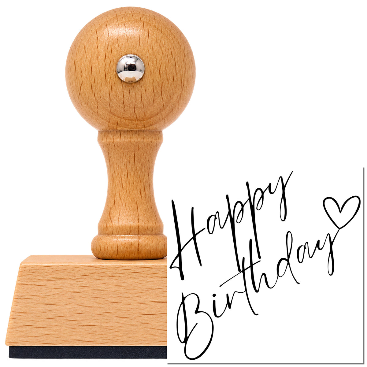 Happy Birthday Diagonal Heart Script Vintage Pro rubber stamp in European beech wood with a round knob handle, shown beside its black imprint.
