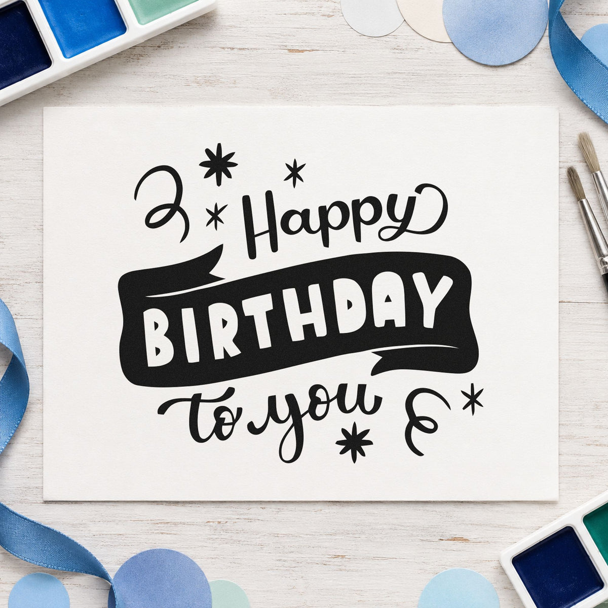 Happy Birthday To You craft stamp imprint in black ink on a handmade project, one idea being shaker gift tags.