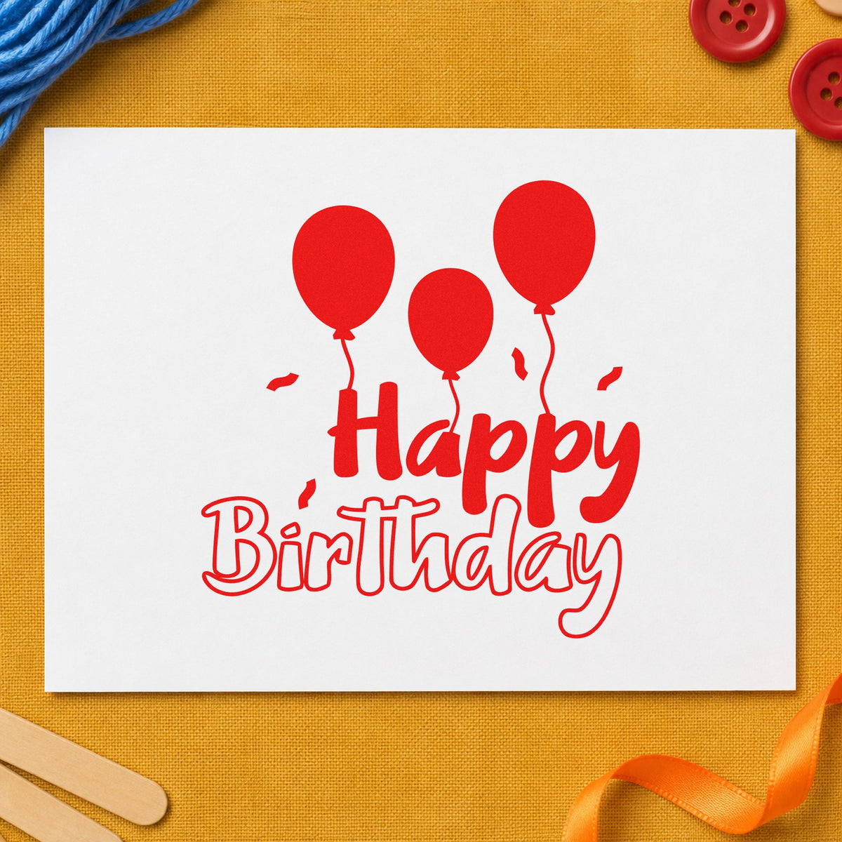 Birthday Three Solid Balloons rubber stamp shown in red ink, stamped for projects such as bin child labels.