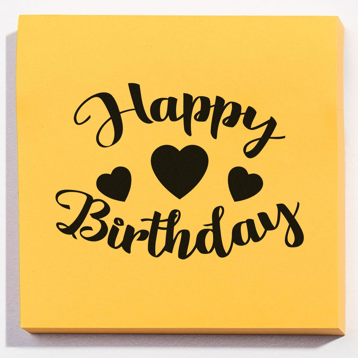 Happy Birthday Three Hearts Premium Wooden Stamp - Vintage Pro imprint stamped in blue ink. Happy Birthday curves around three solid hearts.