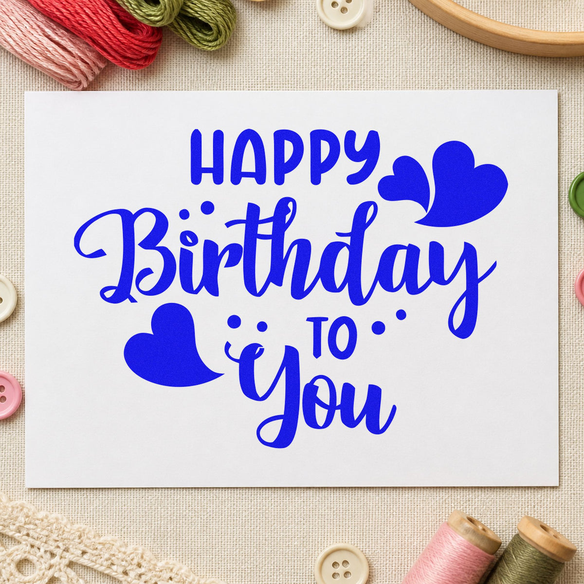 Happy Birthday To You craft stamp imprinted in blue ink on paper, a design suited to framed shared room.