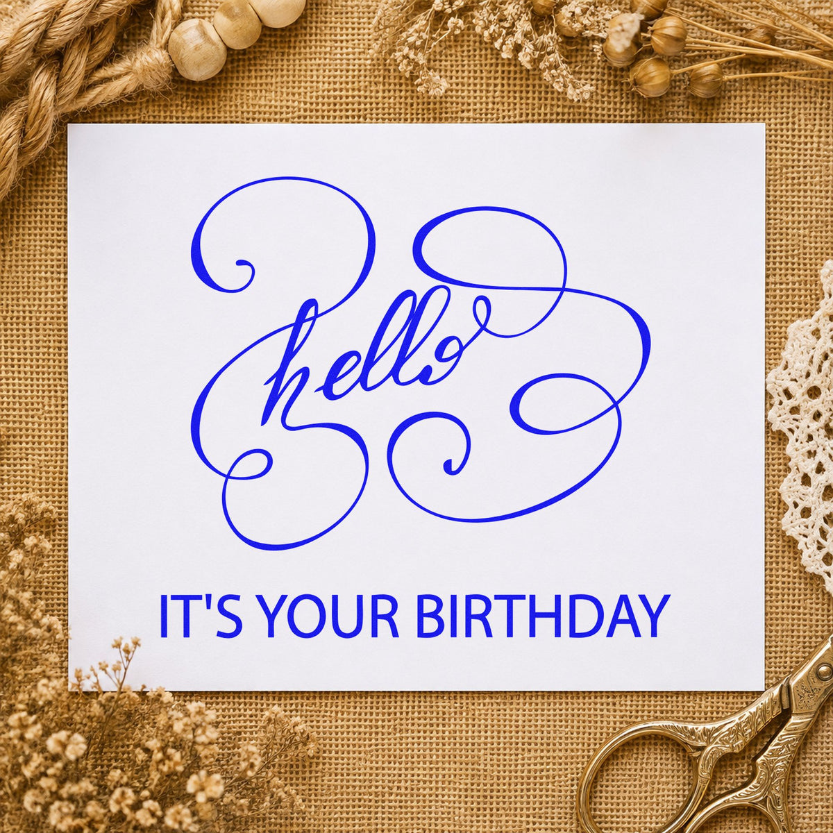 Hello Your Birthday Swirls craft stamp in blue ink on cardstock, an easy option for booth drape printing.