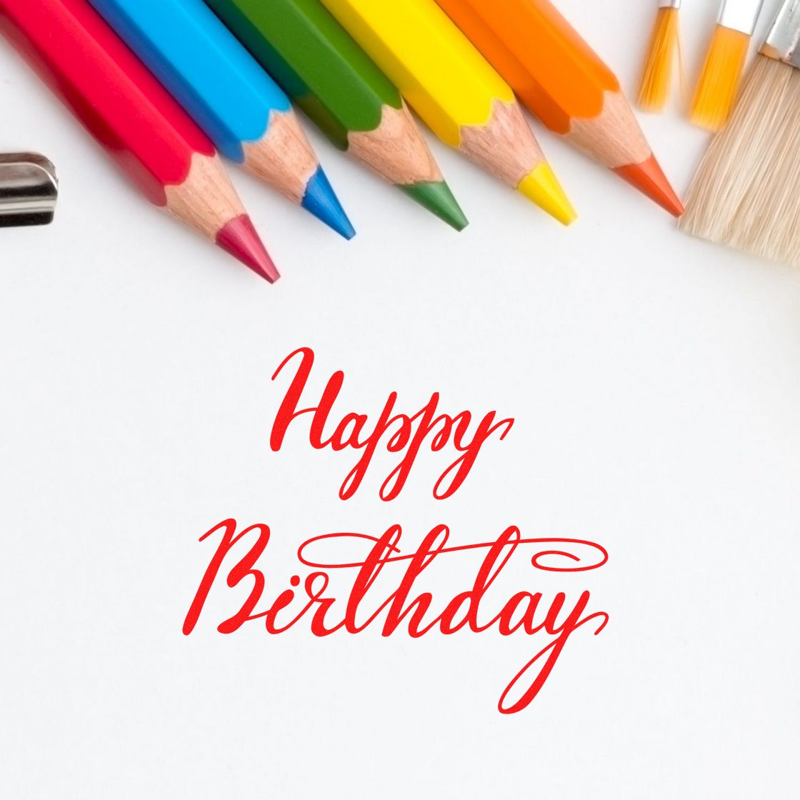 Happy Birthday rubber stamp design for cards and crafts, surrounded by colorful pencils on a white background.