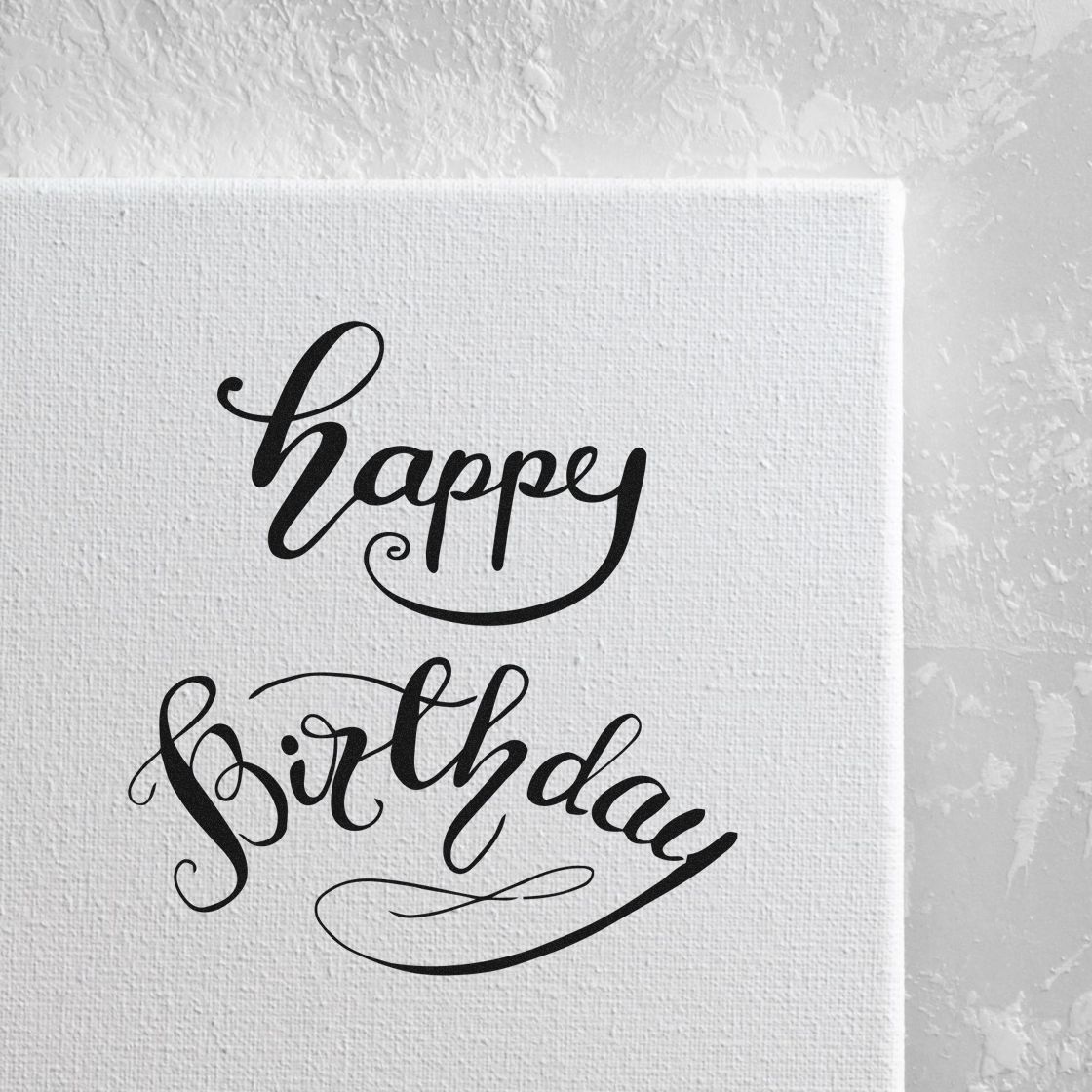 Happy Birthday Curved Script Lettering PSI Pre-Inked Stamp imprint stamped in black ink. happy birthday appears in two lines of graceful script with curved flourishes and an arched lower word.