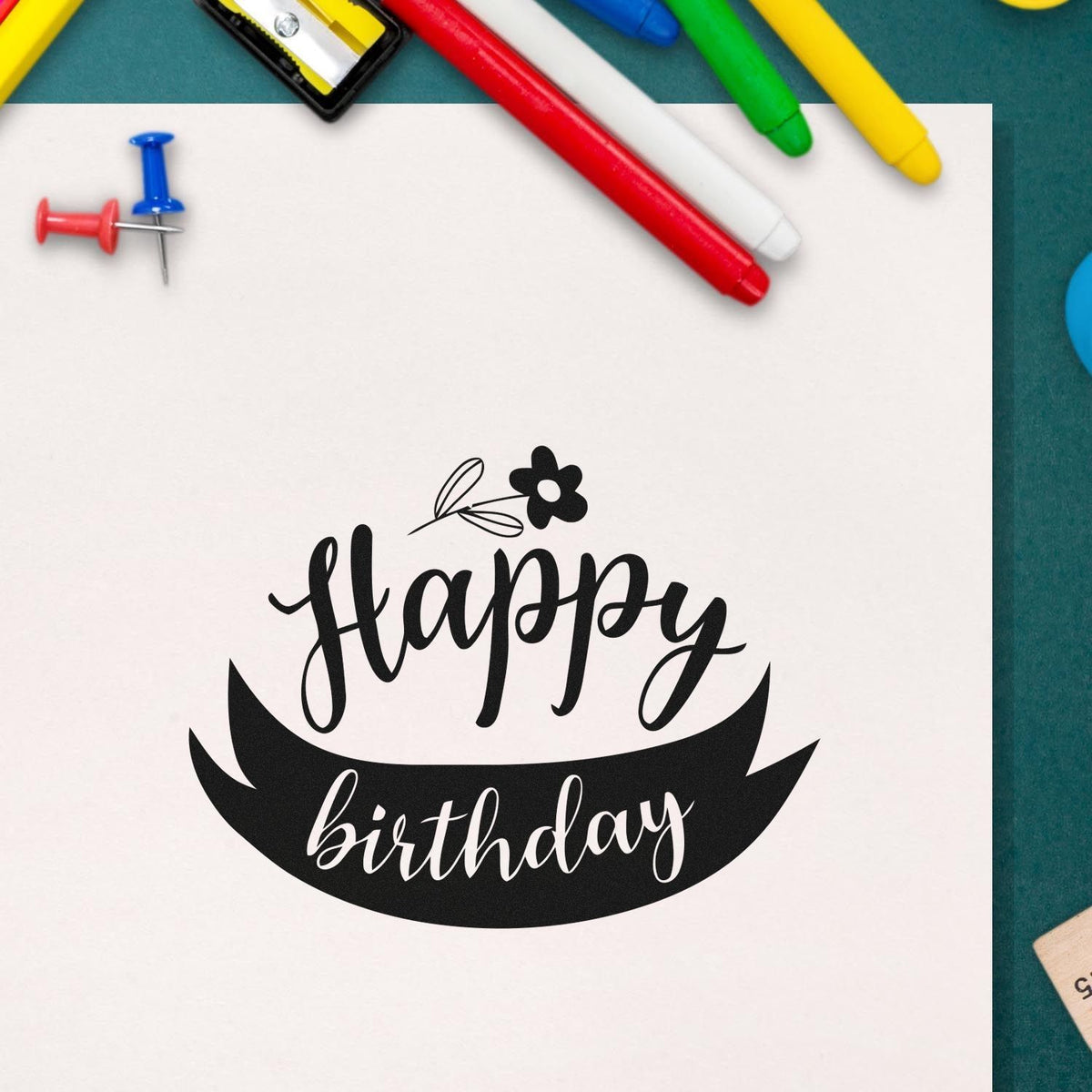 Happy birthday rubber stamp design with floral accent, perfect for handmade cards and party invitations.