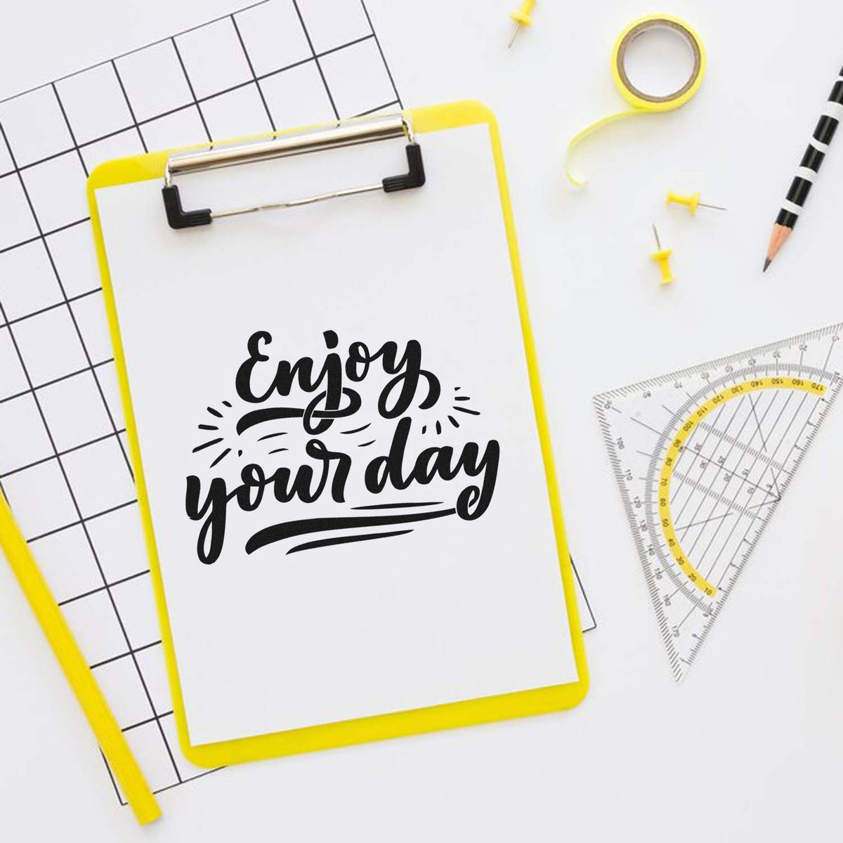 Enjoy Your Day Script Premium Wooden Stamp - Vintage Pro imprint stamped in black ink. Enjoy your day appears in bold script with radiating accents and layered underlines.