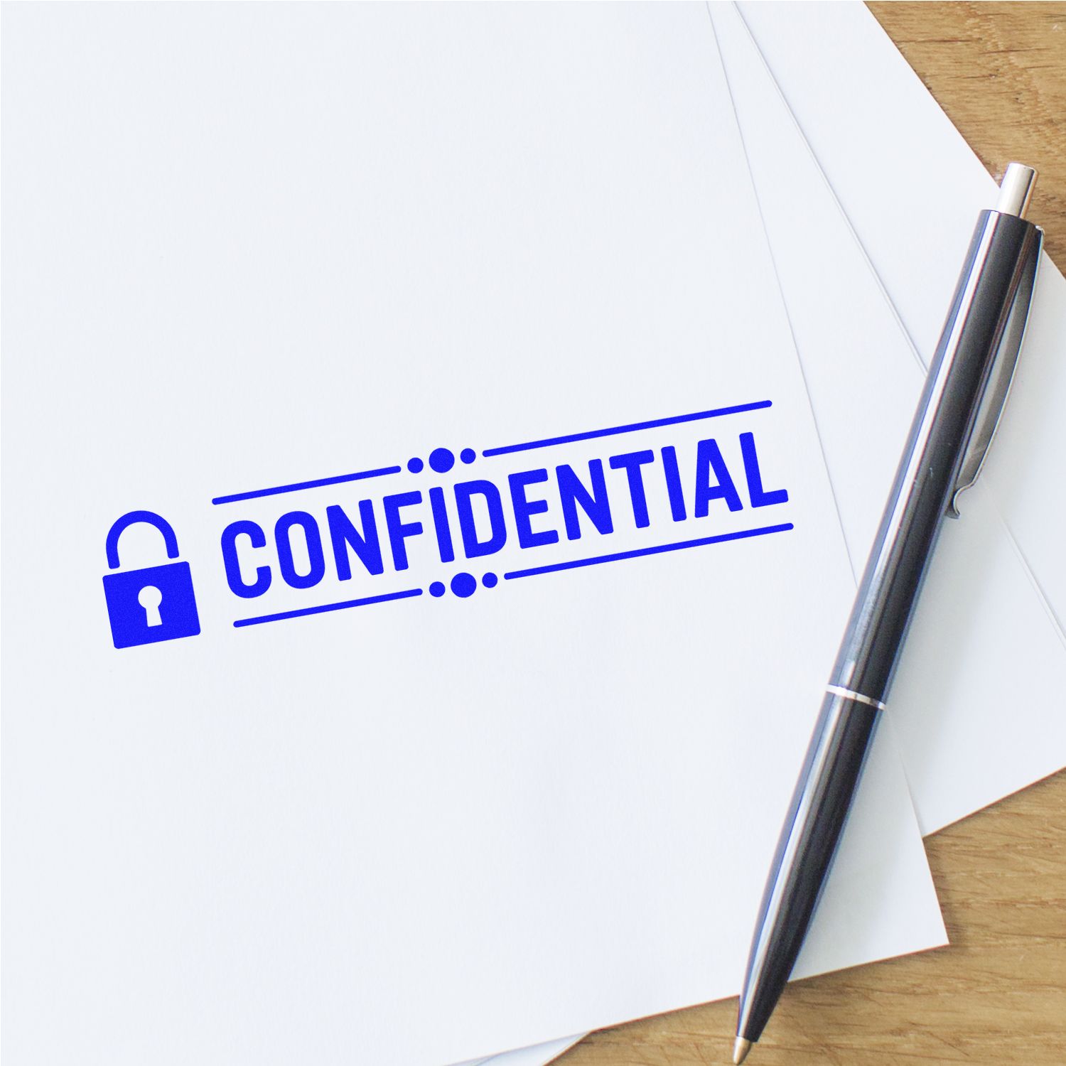 Confidential rubber stamp on document with pen, ideal for marking private files and office document security.