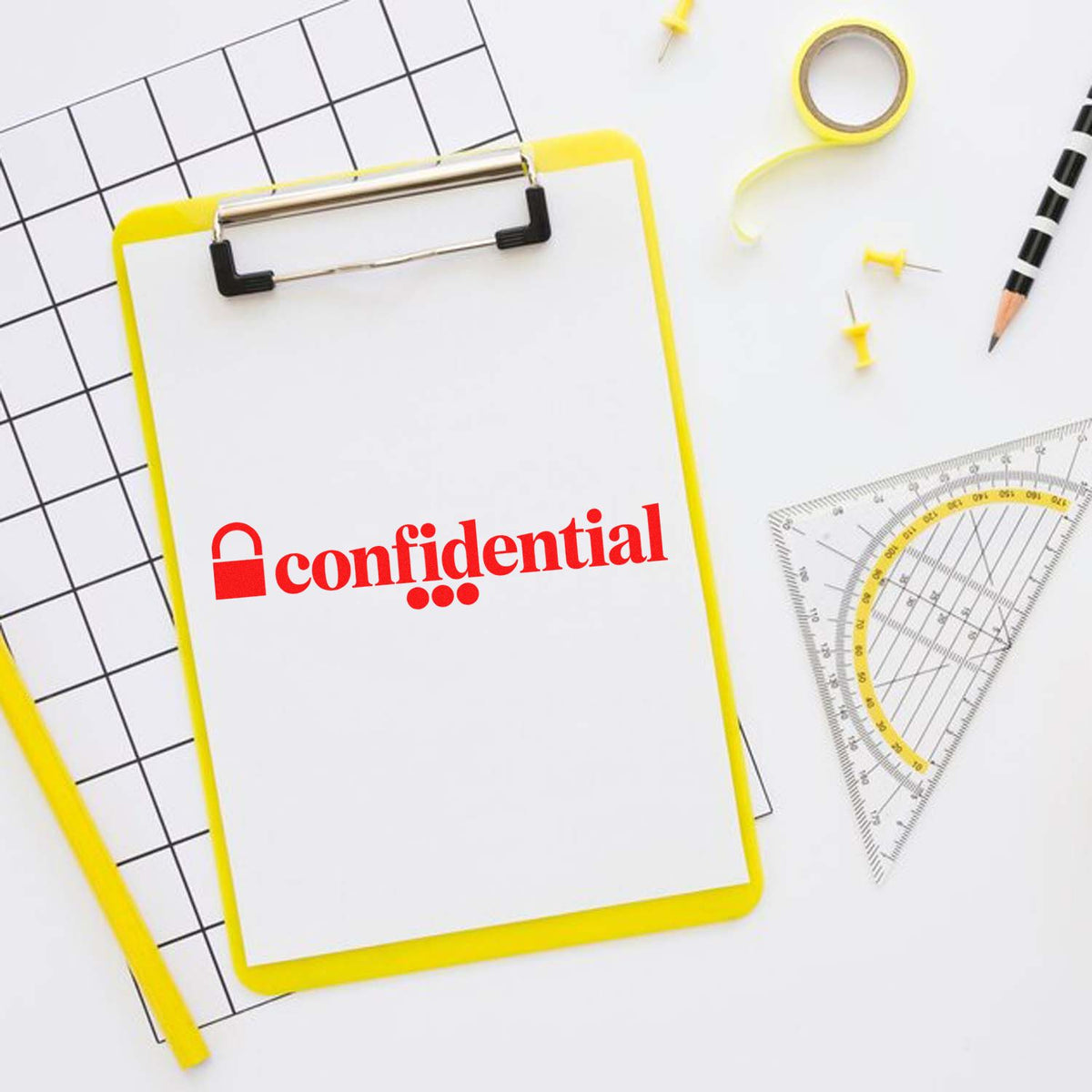 Confidential rubber stamp on clipboard with office stationery, ideal for secure document marking and filing.