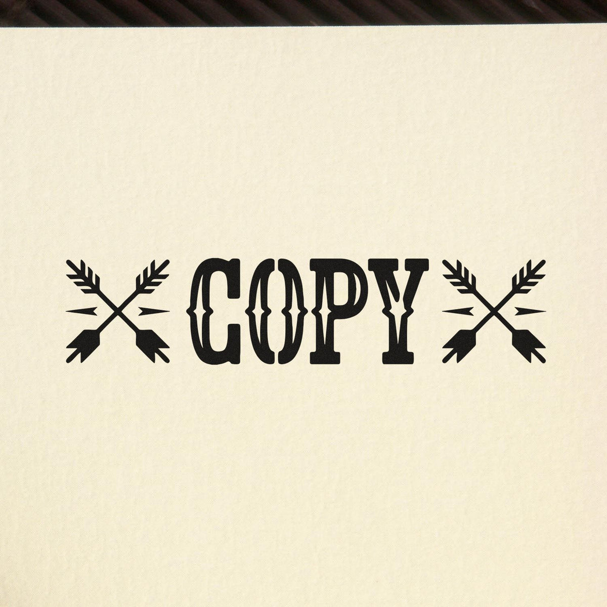 Copy rubber stamp design with crossed arrows for marking duplicate documents.