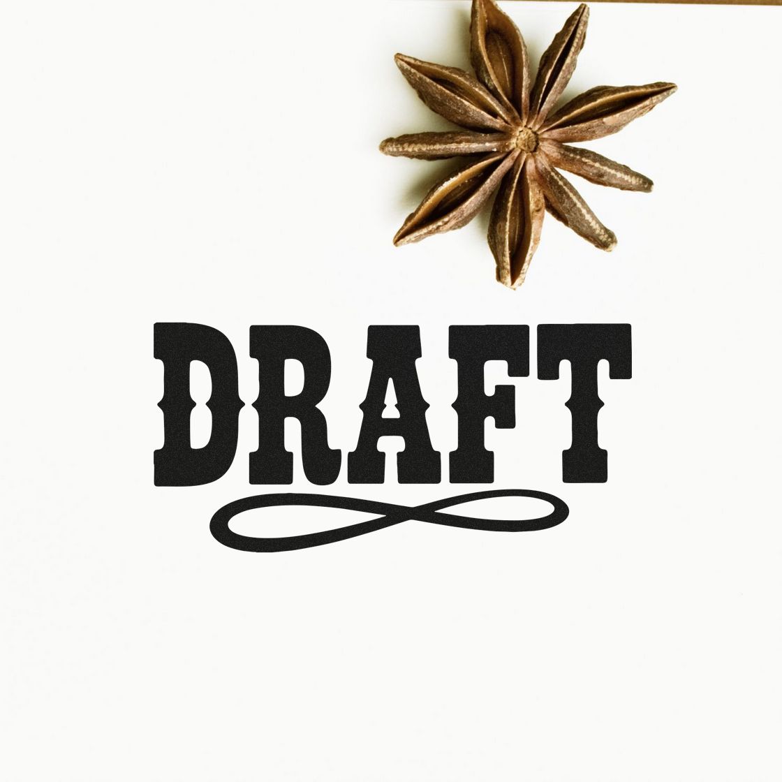 Draft rubber stamp design with decorative flourish and star anise accent on white background