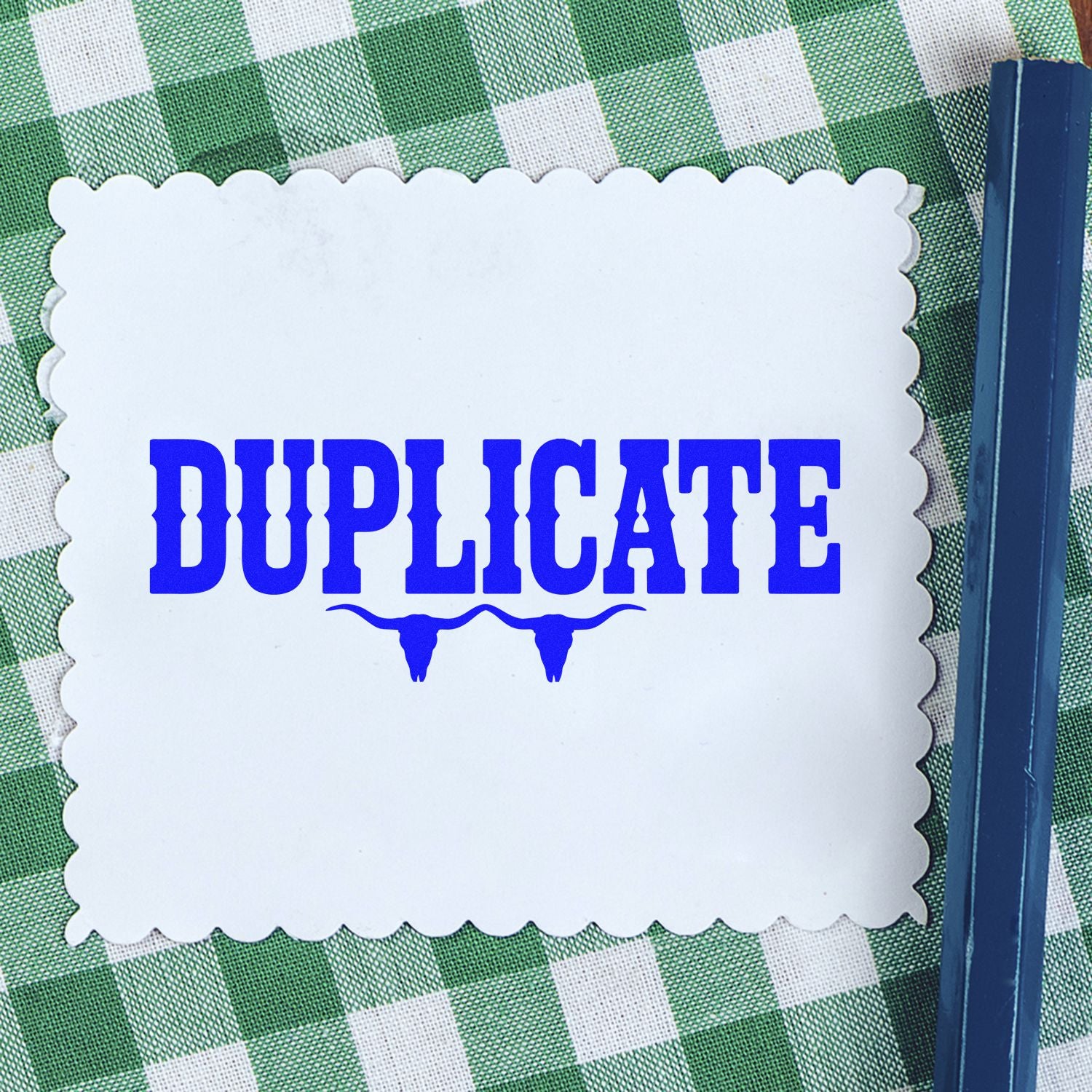 Duplicate rubber stamp impression on scalloped cardstock, ideal for office document marking and filing.