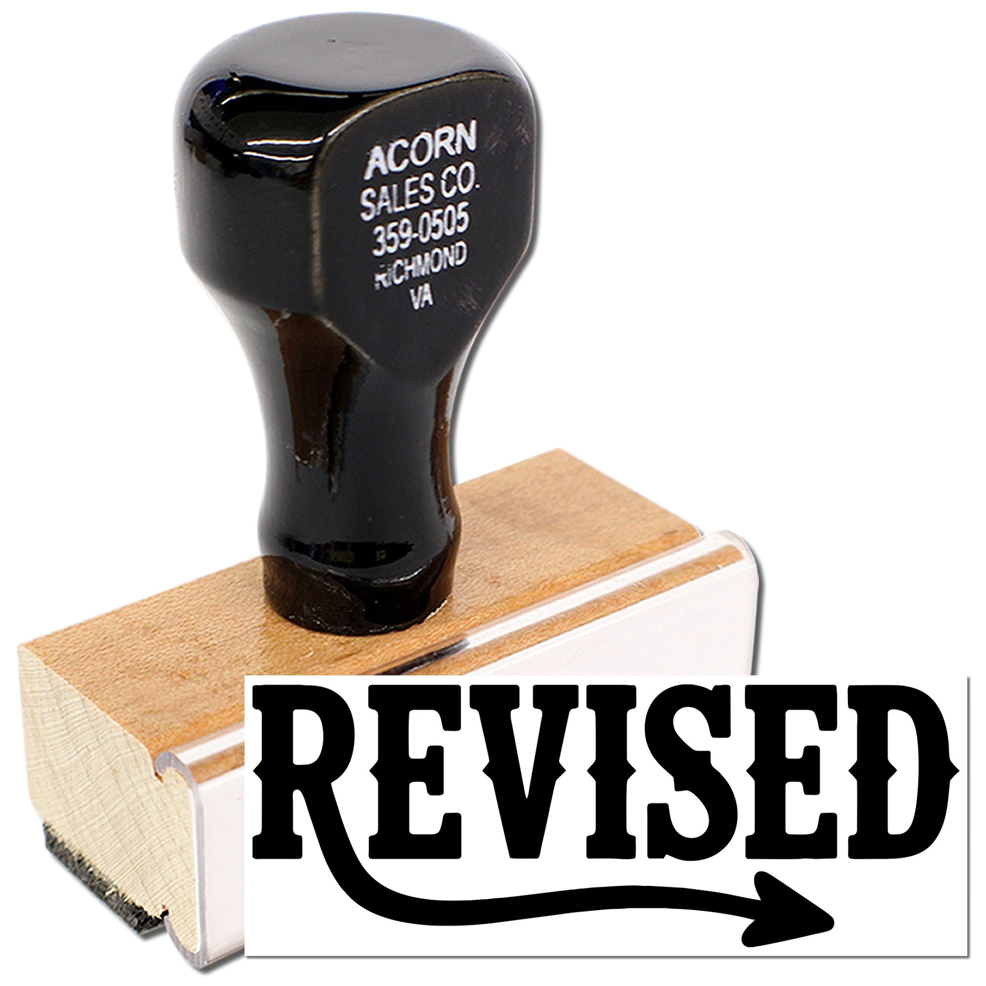 Revised rubber stamp for document approval, marking files and office paperwork with a bold correction label.
