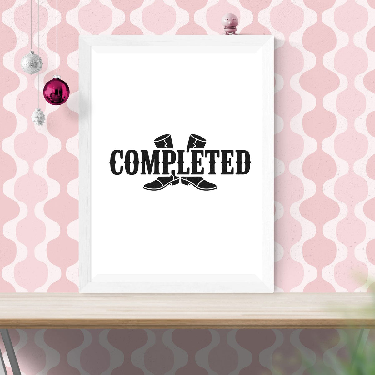 Completed rubber stamp mockup with boot graphic, shown in a white frame on a pink patterned background.