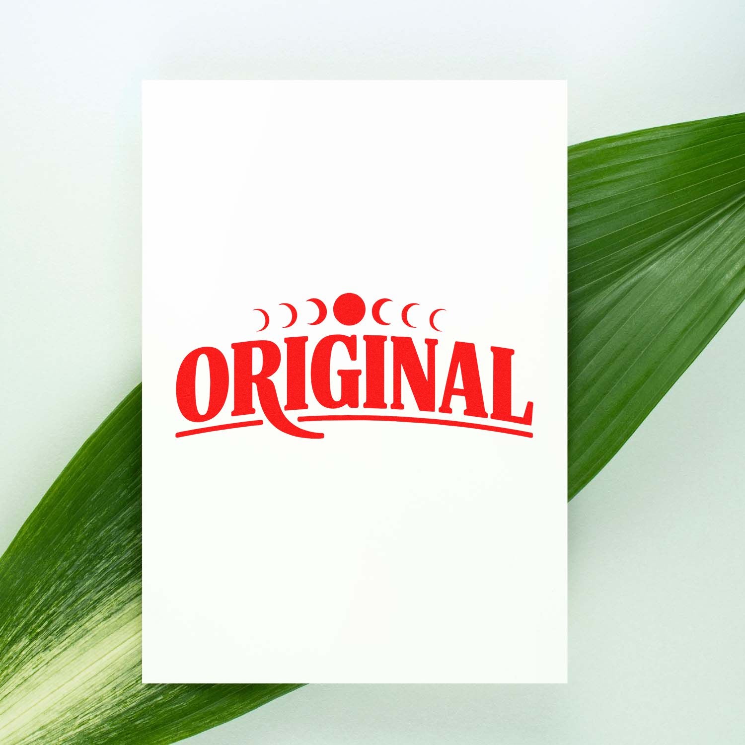 Red Original rubber stamp impression on white paper, showcasing a custom branding rubber stamp design for packaging and approvals.