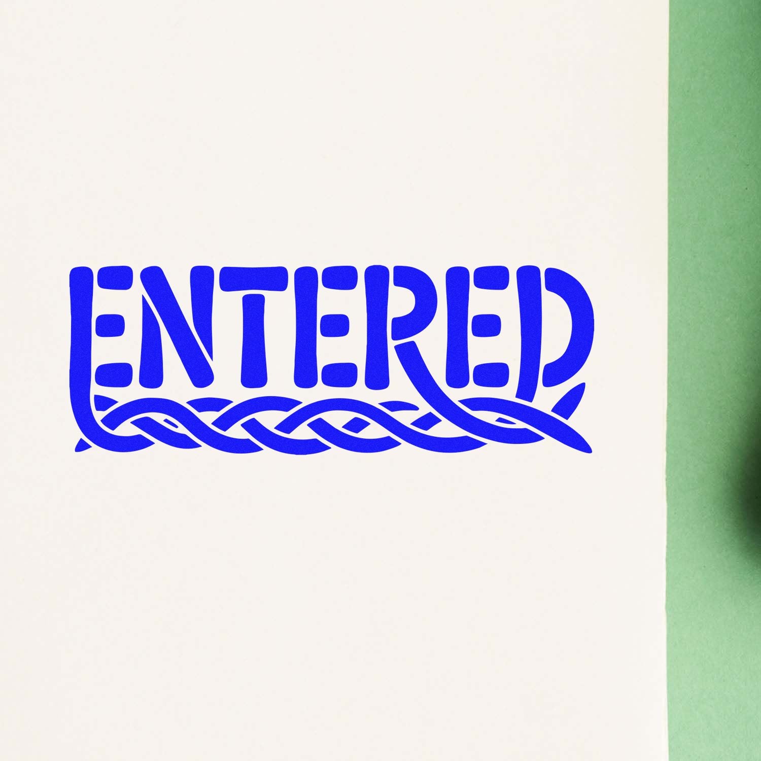 Blue ENTERED rubber stamp imprint on paper for document processing.