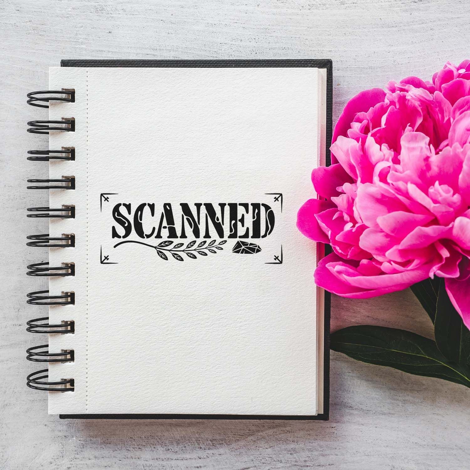 Scanned rubber stamp design on a spiral notebook with pink peonies, perfect for crafting and scrapbook projects.