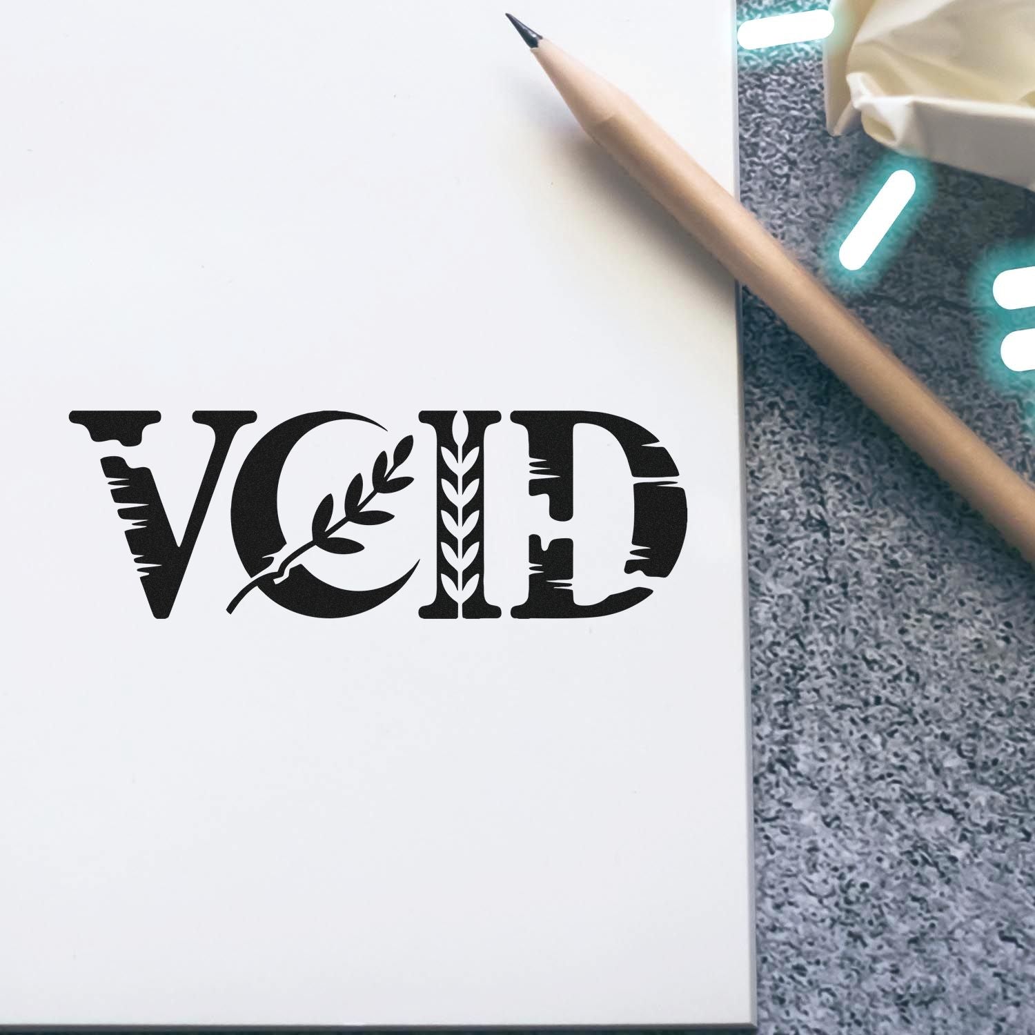 Void rubber stamp imprint on notebook page, ideal for office document marking and craft projects.