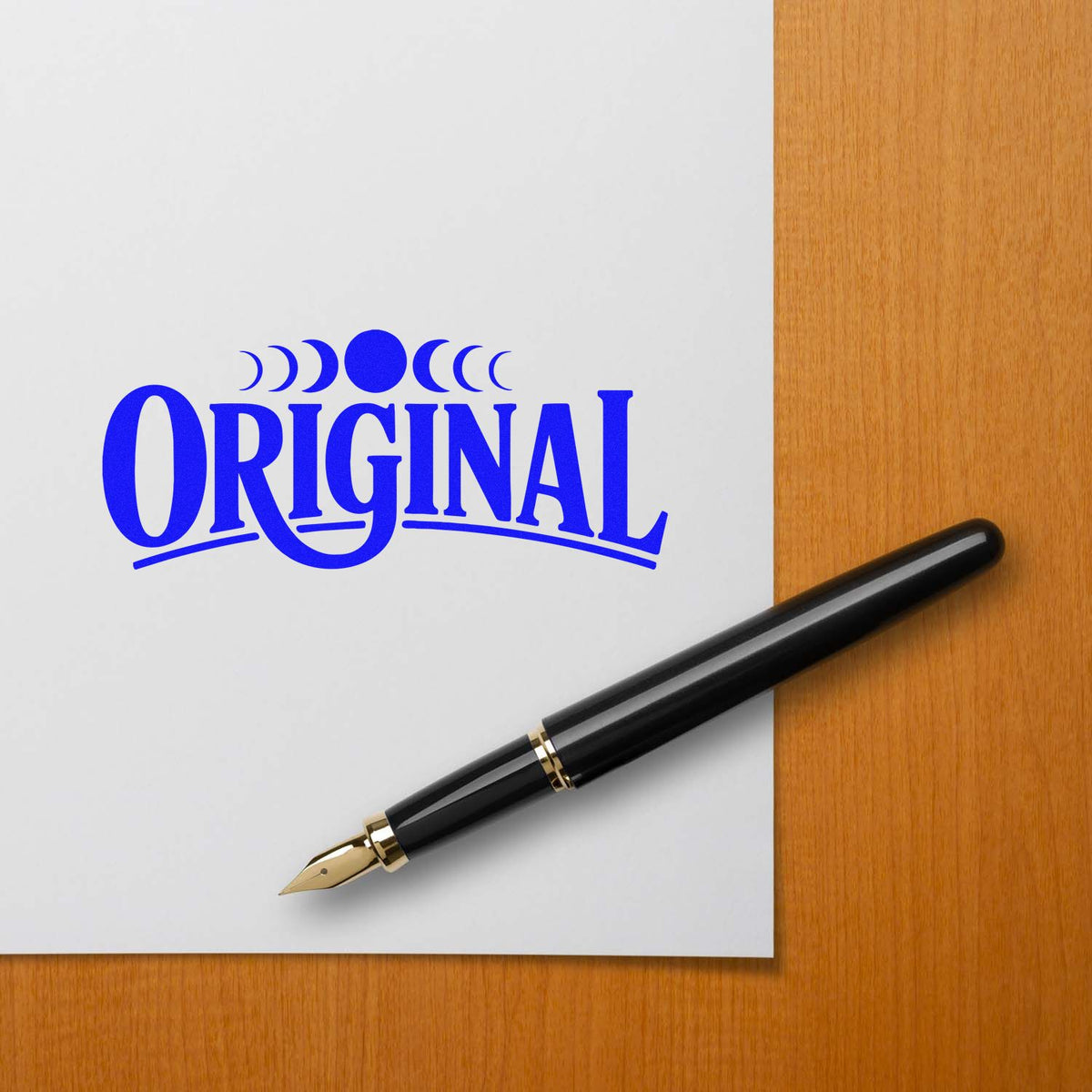 Blue Original rubber stamp design on paper with fountain pen, ideal for authentic document marking and branding.