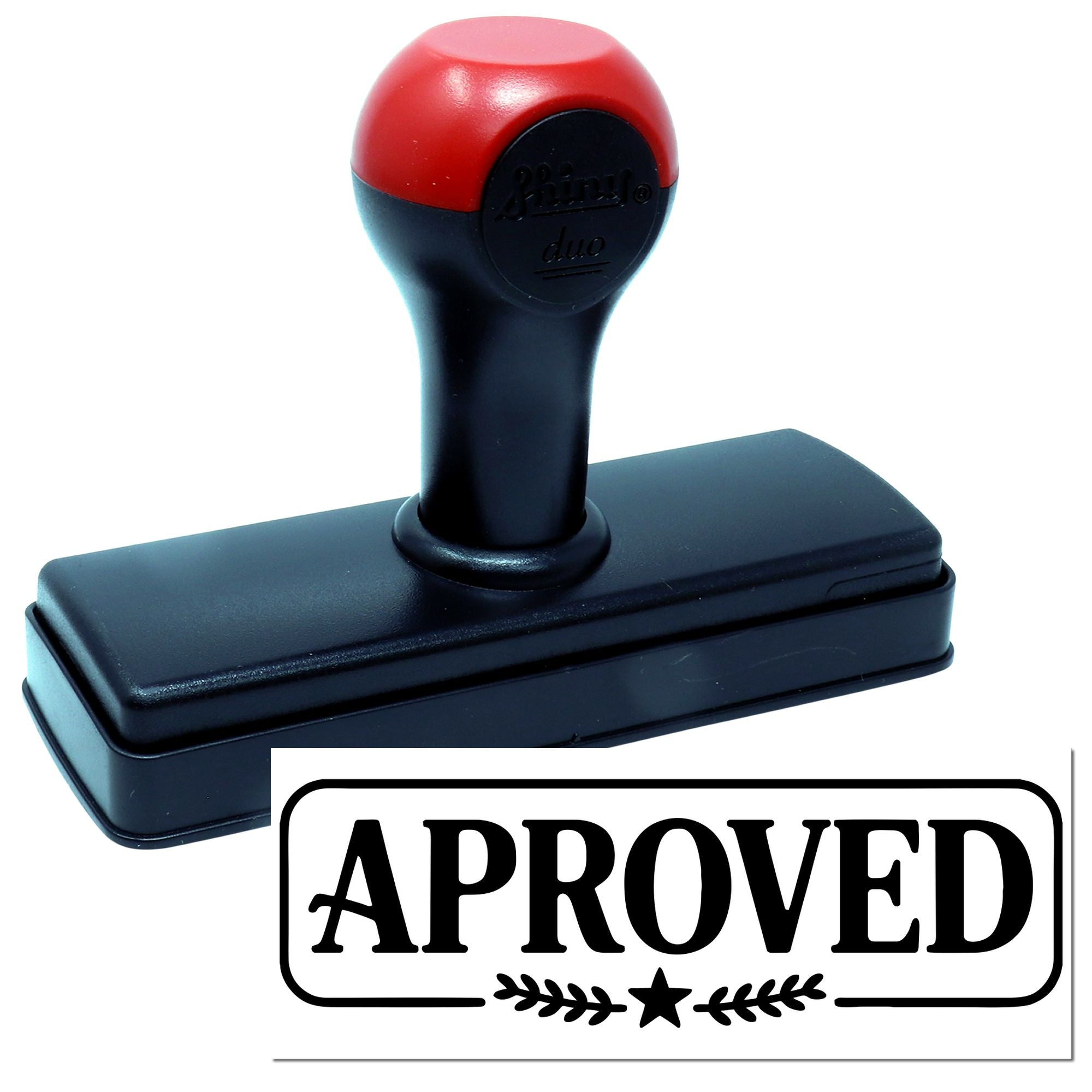 Self-inking rubber stamp with red and black handle showing an APPROVED imprint for office use.