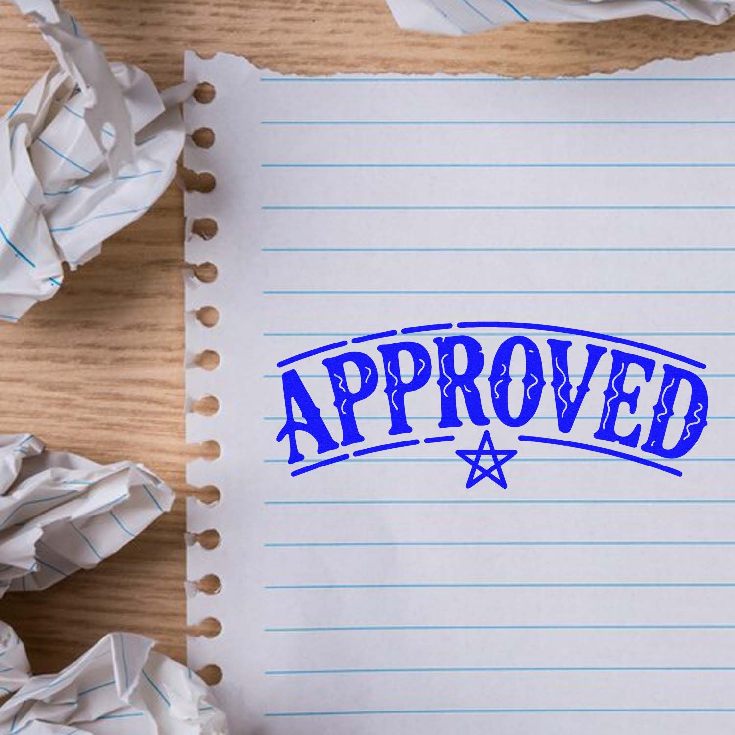 Blue APPROVED rubber stamp on lined paper, showing a custom office approval stamp for documents, branding, and marking projects.