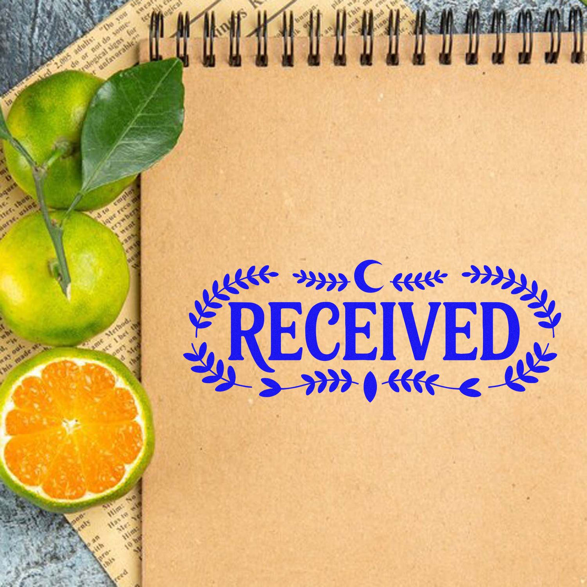 Received rubber stamp on kraft notebook paper with citrus decor, ideal for office paperwork and handmade packaging.
