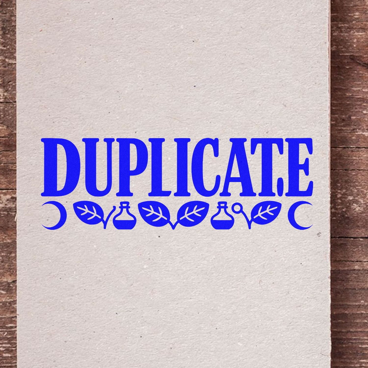 Duplicate rubber stamp design in blue with decorative leaves, perfect for marking copies on cards or paper.