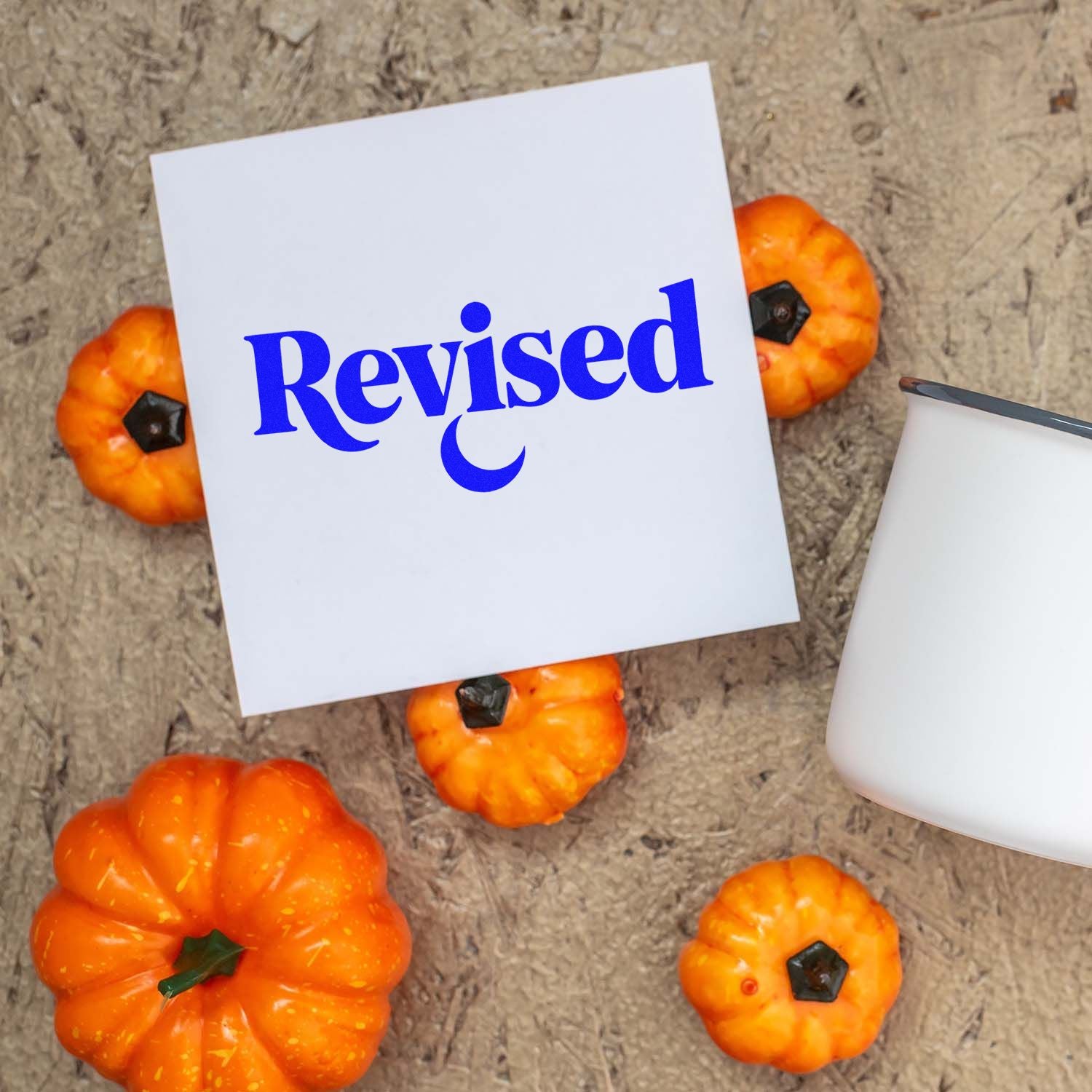 Revised rubber stamp impression on paper, perfect for marking edited documents, office files, and autumn-themed crafts.