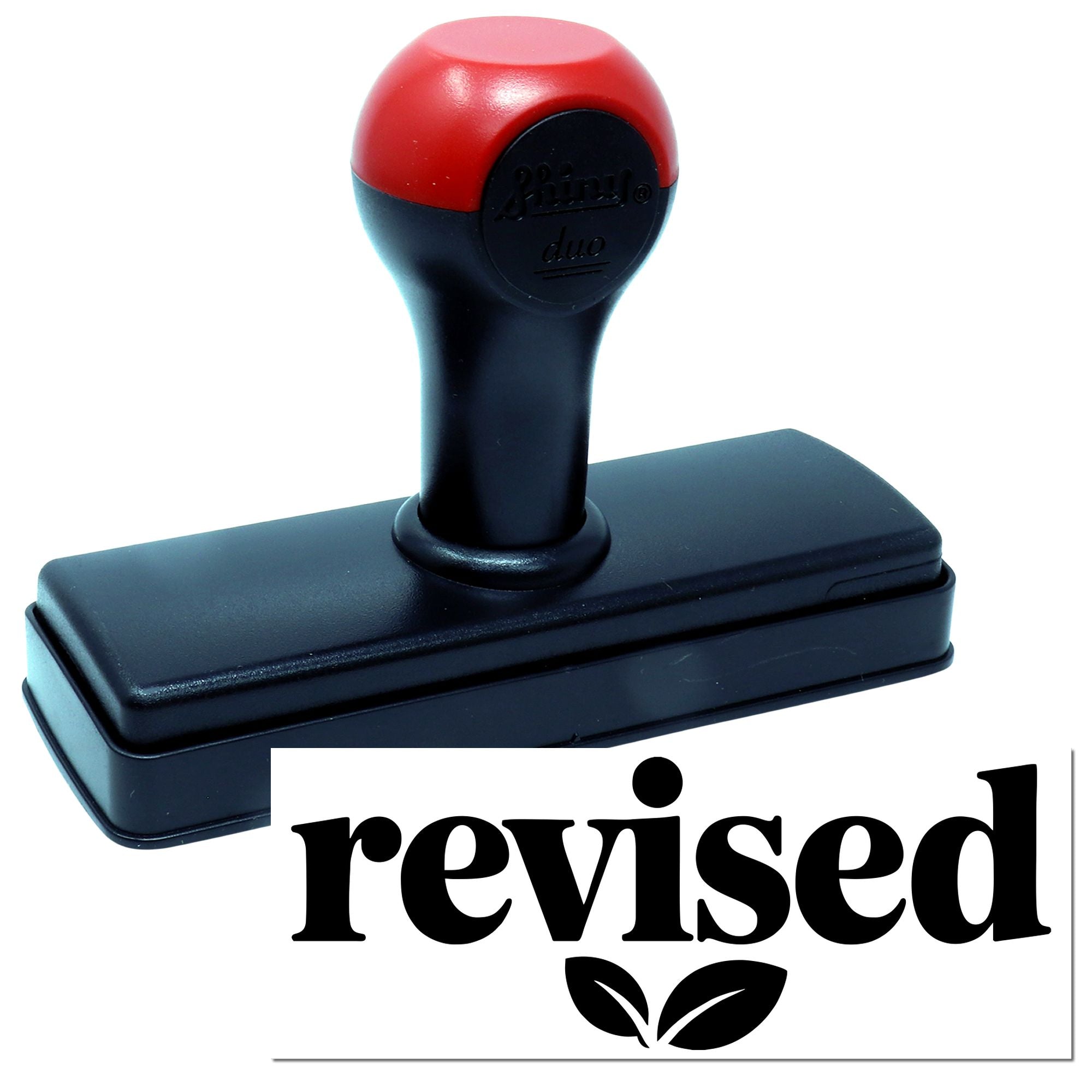Self-inking revised rubber stamp with bold revised imprint for office document approval and record updates.