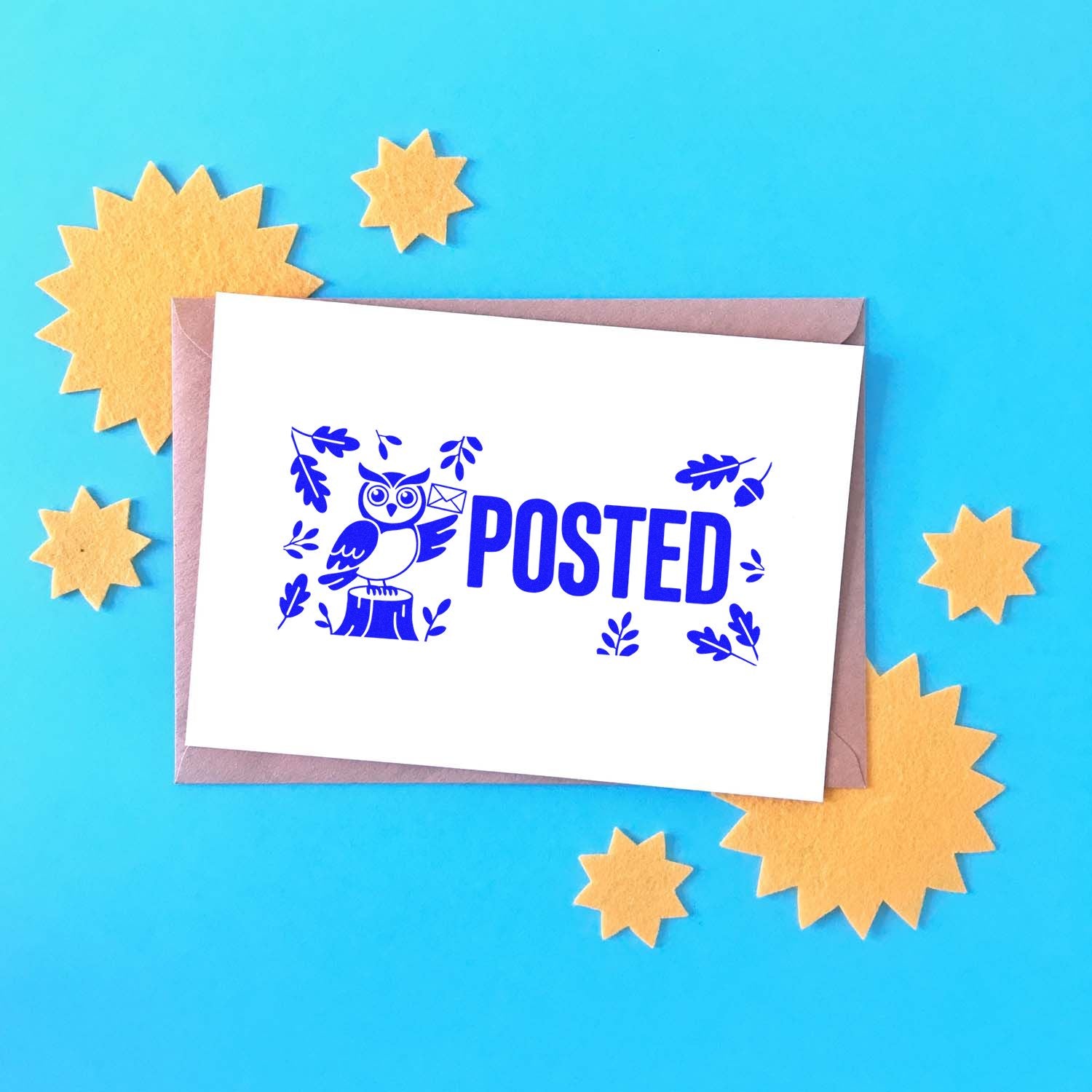 Rubber stamp design featuring an owl and the word POSTED on a greeting card, ideal for handmade mail and paper crafts.