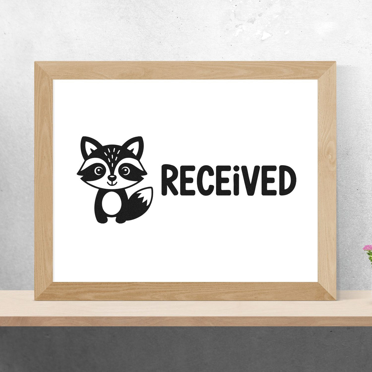 Raccoon RECEIVED rubber stamp design mockup for mail, packaging, and office documents.
