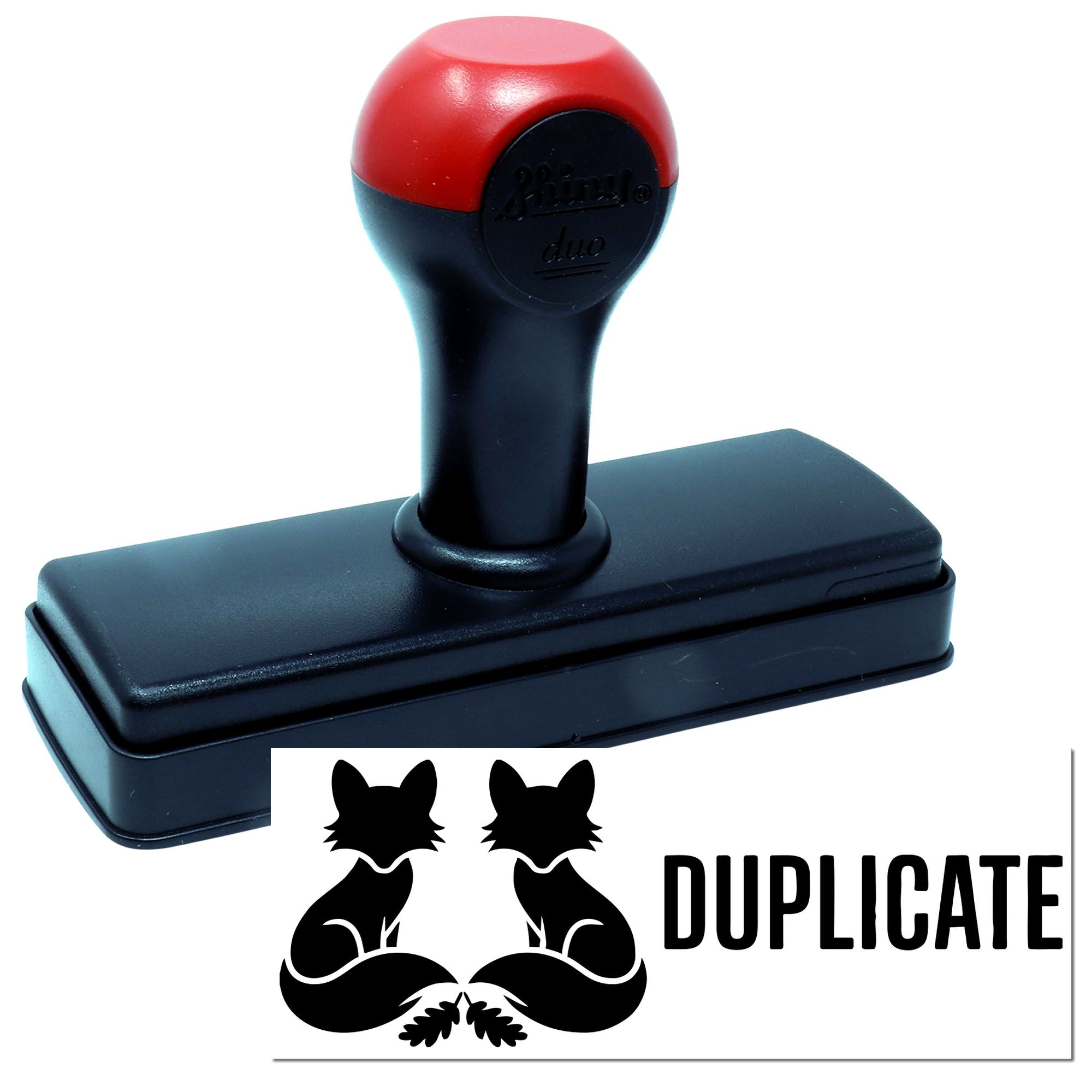 Self-inking rubber stamp showing a Duplicate imprint for office document control.