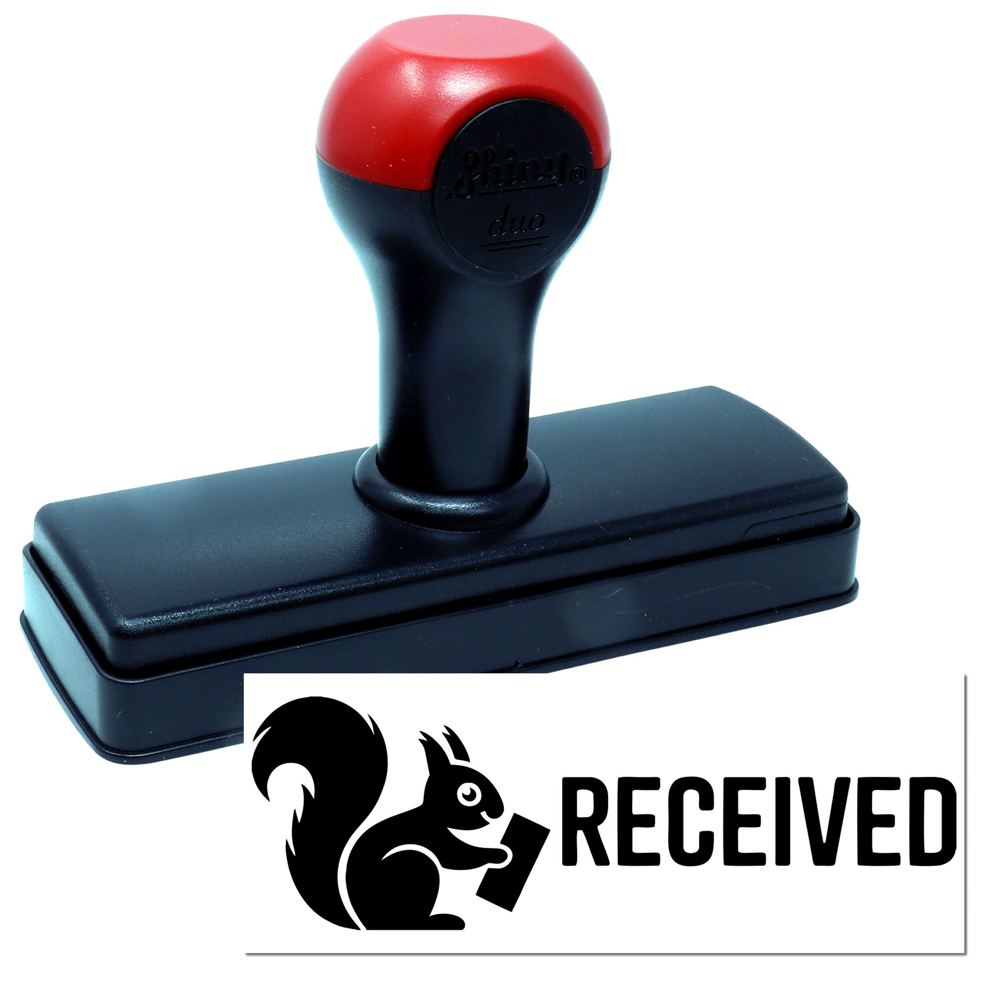 Custom self-inking rubber stamp with RECEIVED imprint and squirrel logo for office mail approval and document processing.