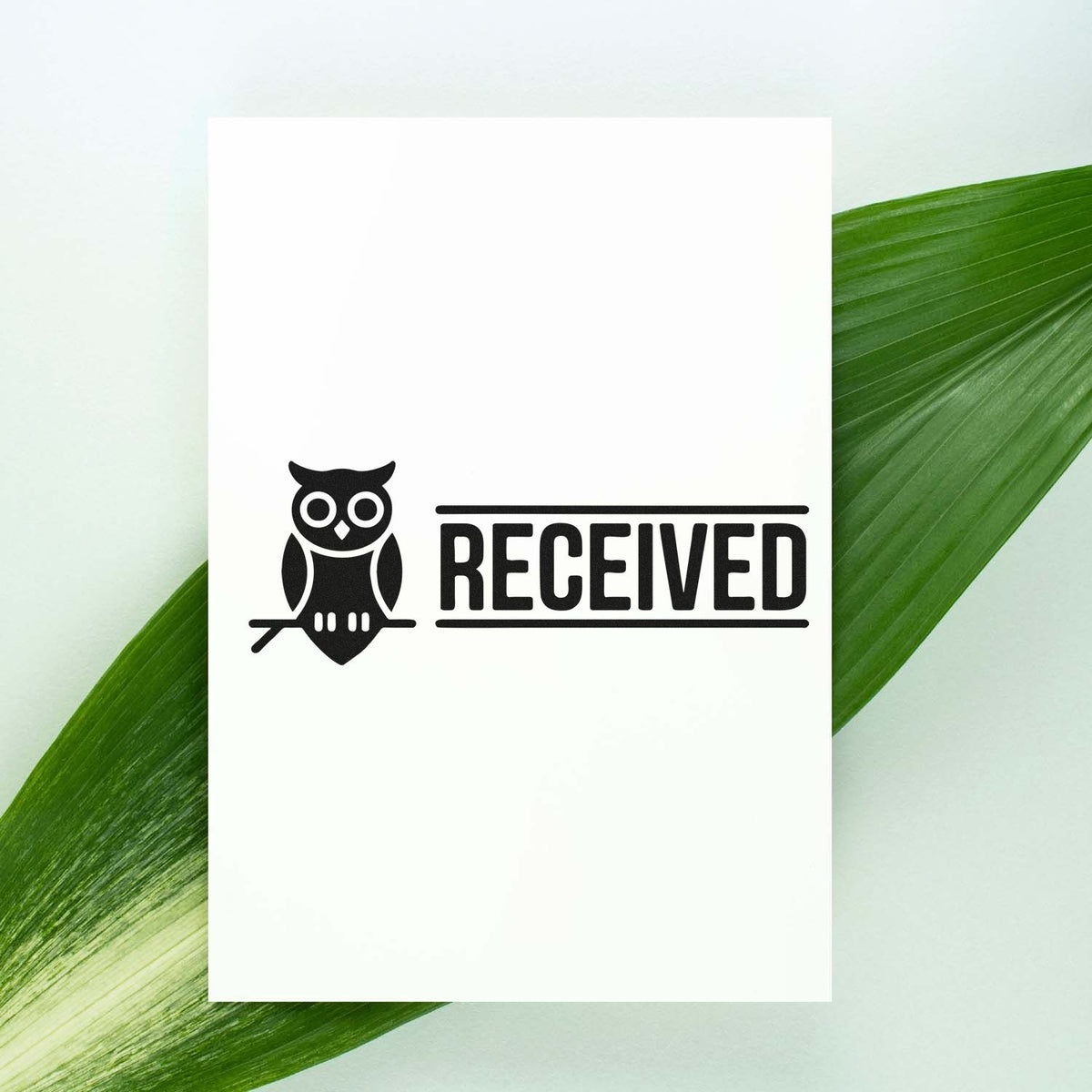 Owl RECEIVED rubber stamp design for office documents, mail, and packages, shown on a clean white paper background.